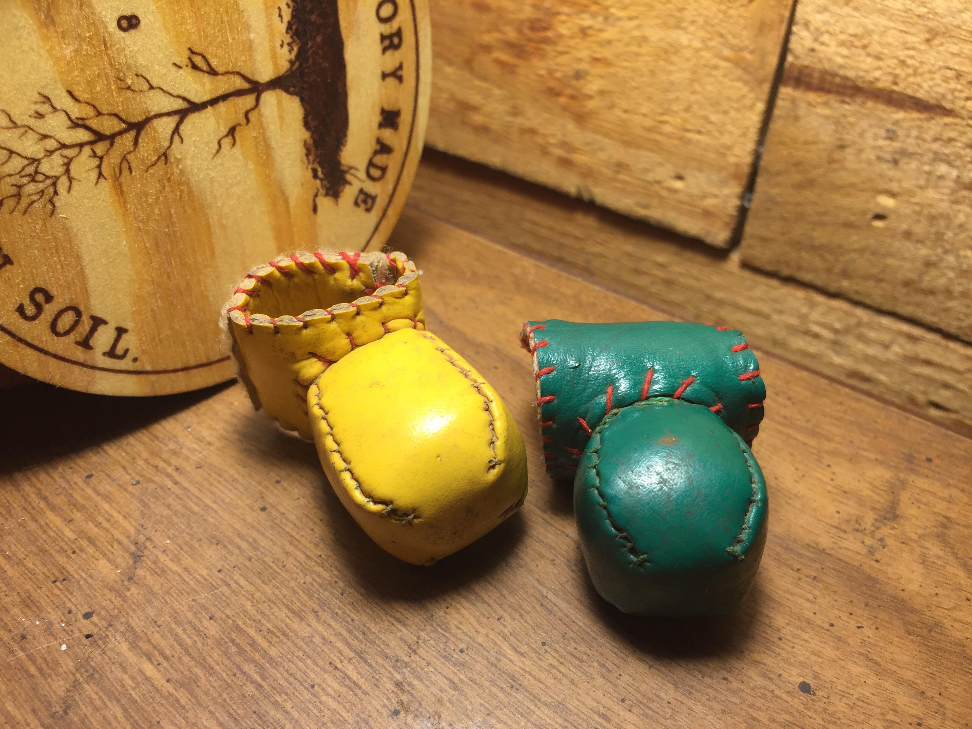 These chicken boxing gloves used to cover spurs when training fighting