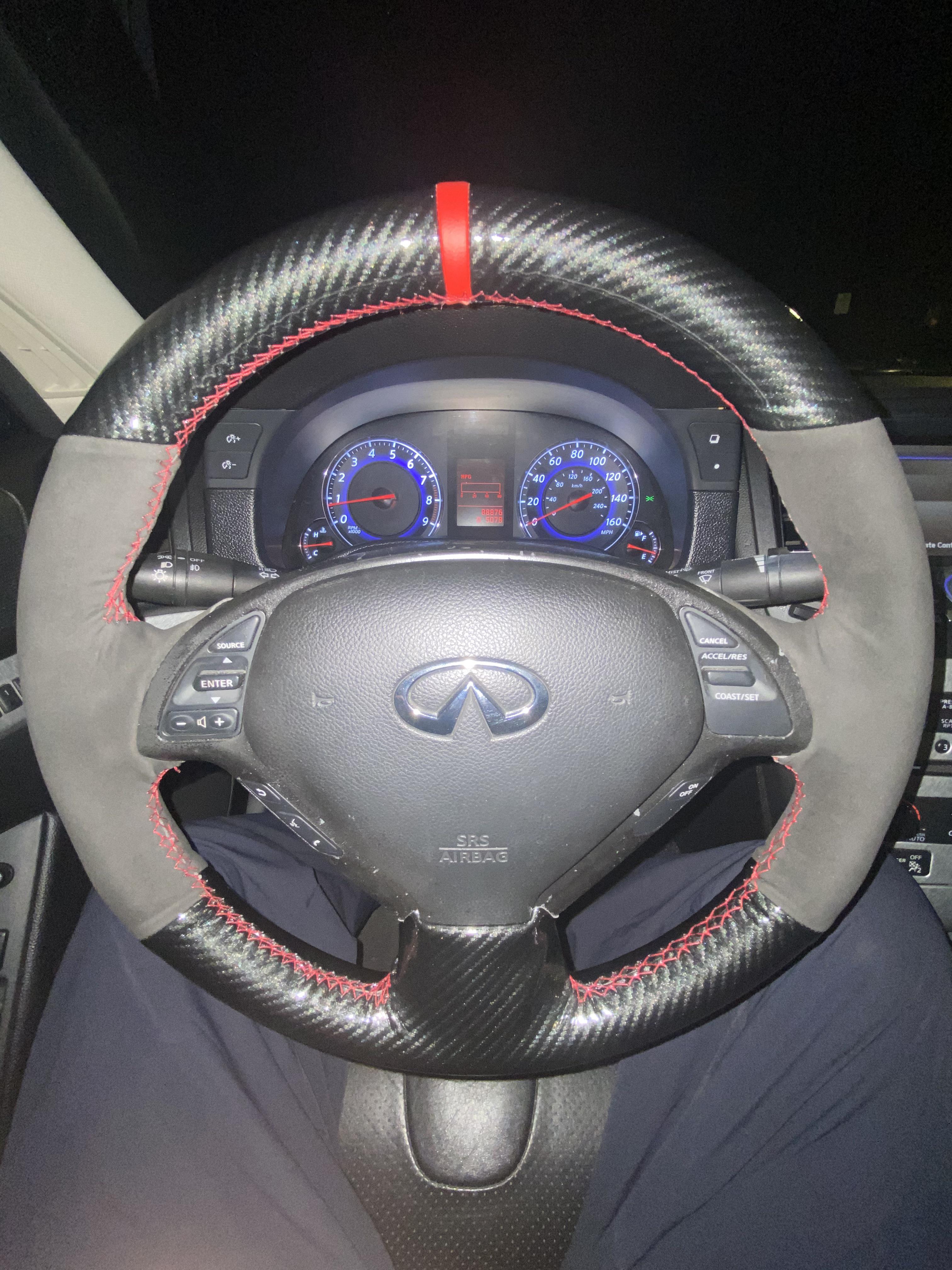 Sew on steering wheel cover. Took hours to install but was worth it