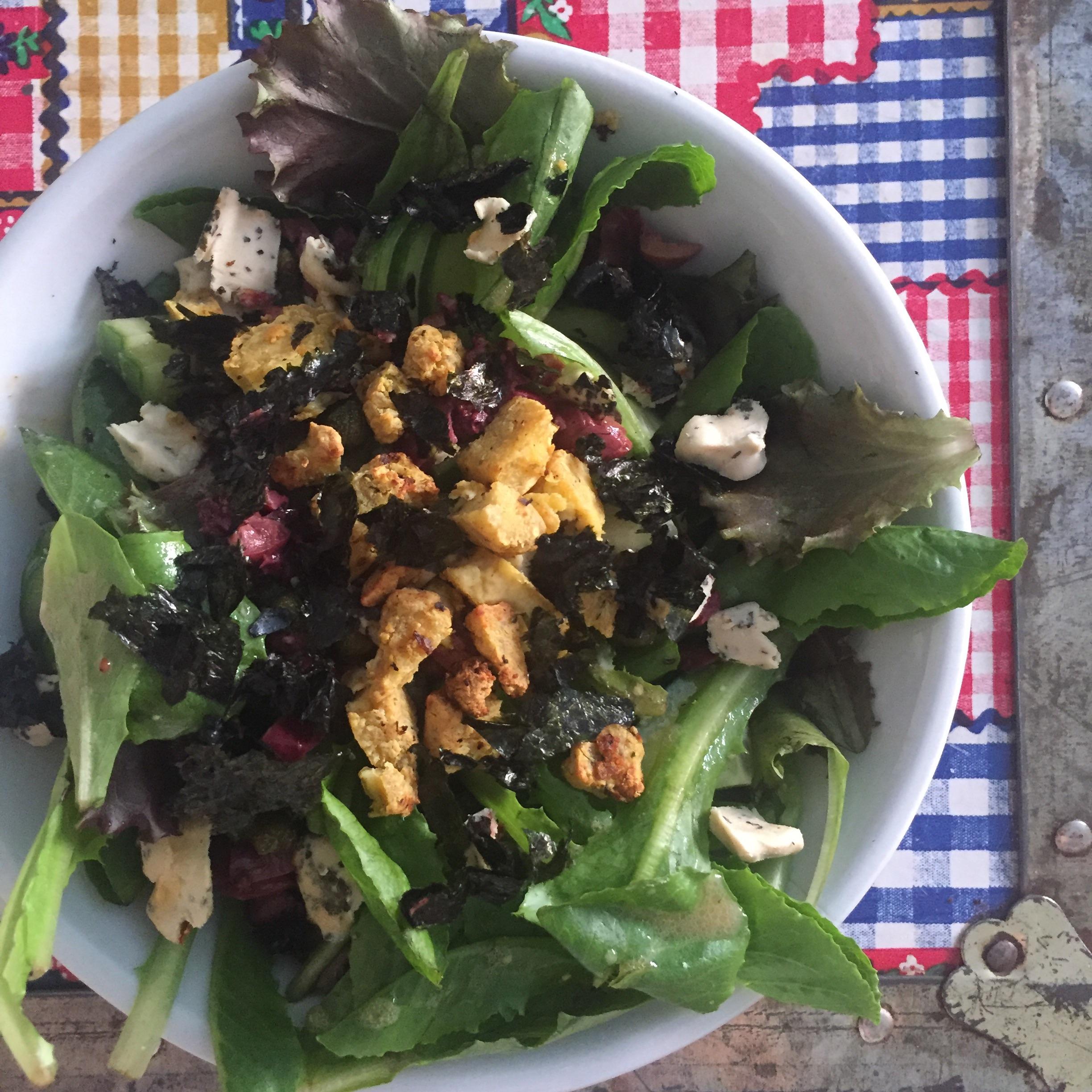 Green salad with fried tofu crumbles, nori flakes and cashew cheese😍