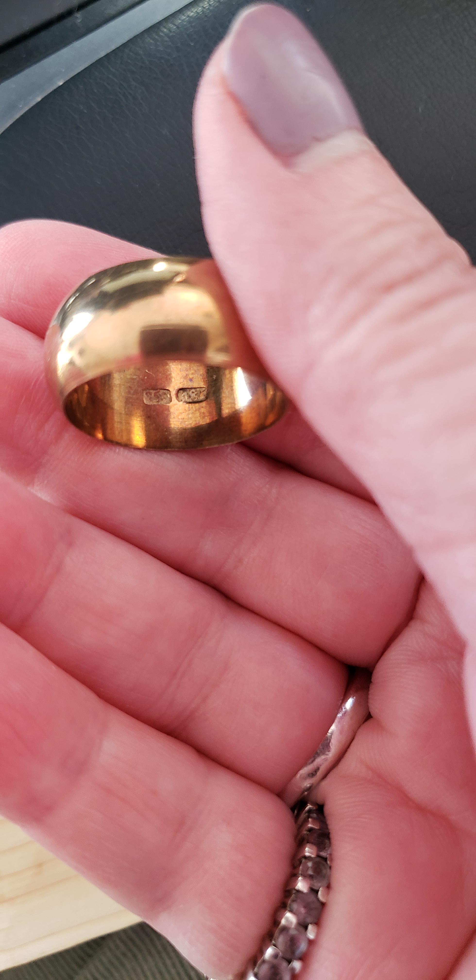 Real? or Faker? It's marked 18K and 750 suggesting it's gold but the