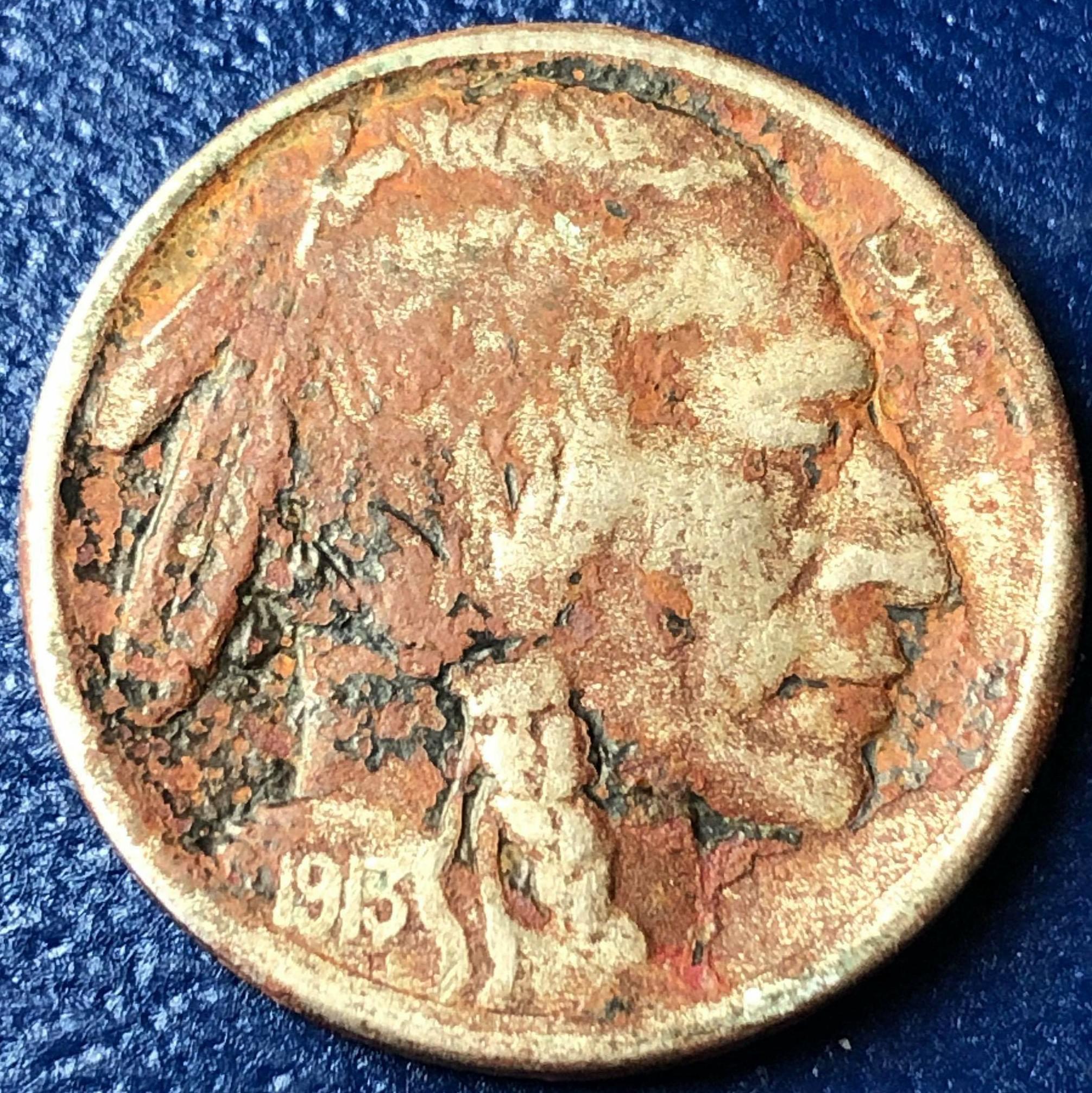 I know not to clean coins, but is there any way to safely remove the