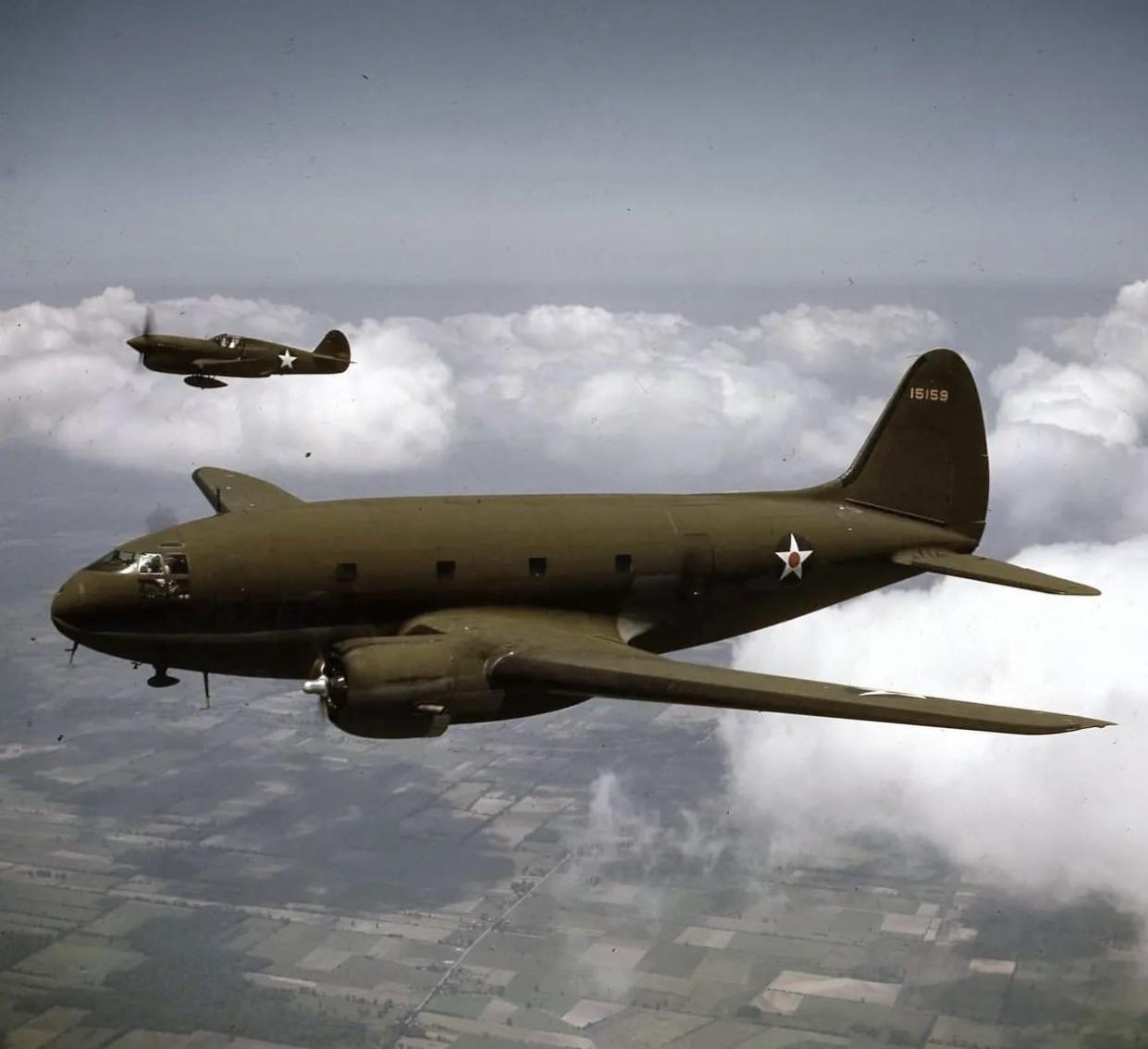P40F Warhawk flying in formation with a C46 Commando r/WWIIplanes