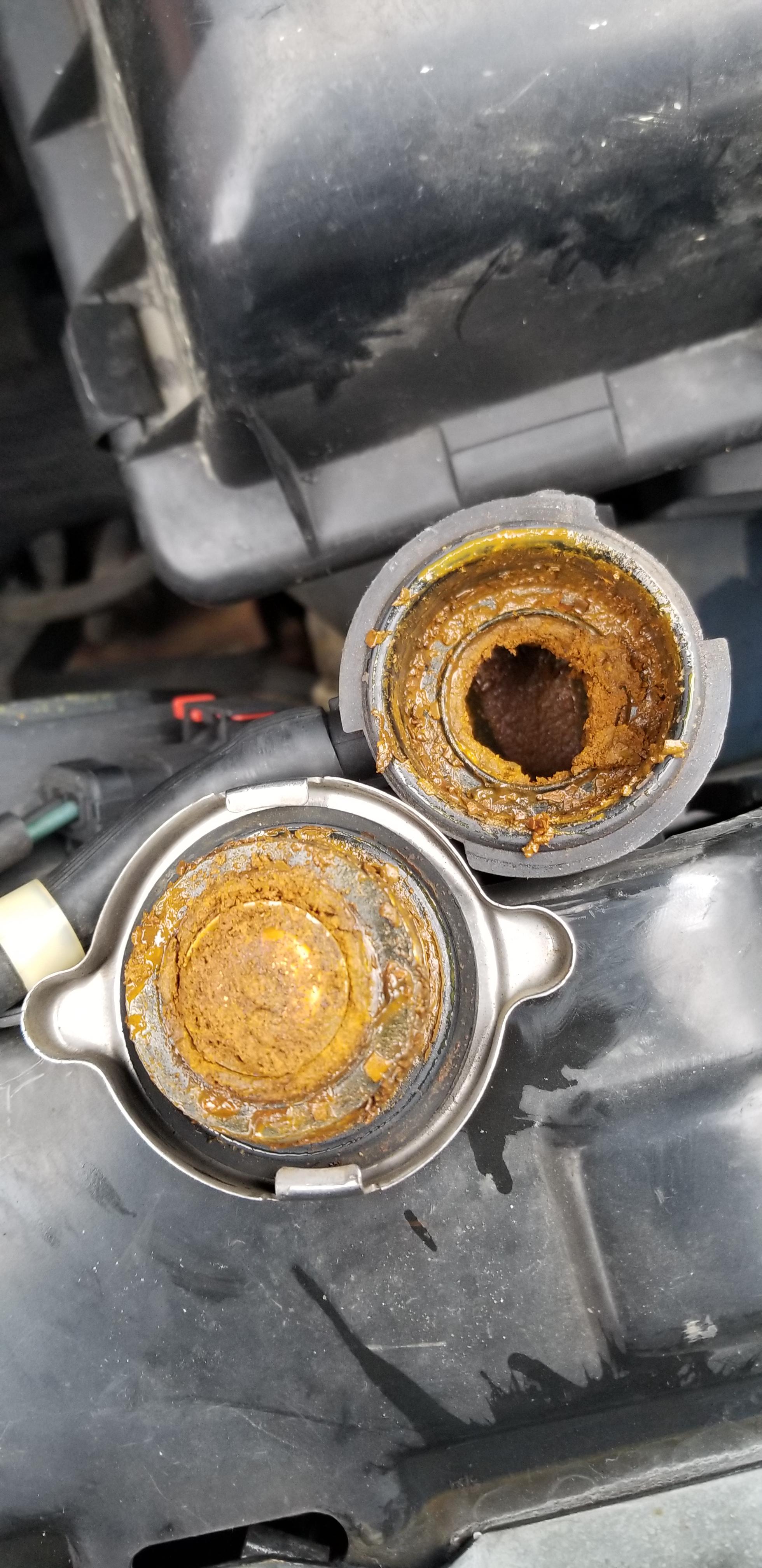 Sludge under the cap. Very recent overheat. Oil seems fine. What should