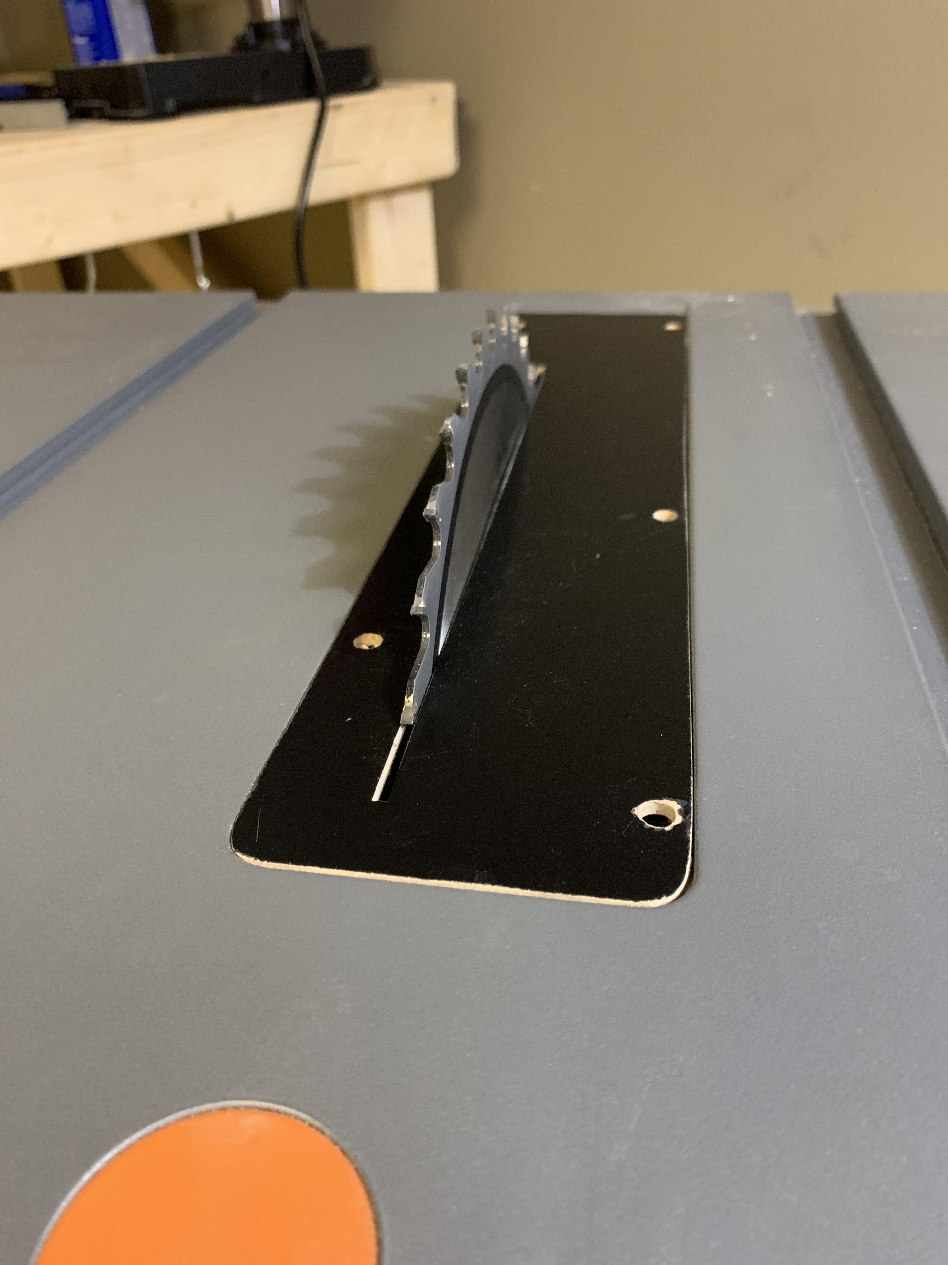 Rigid table saw zero clearance throat plate. Used dry erase board