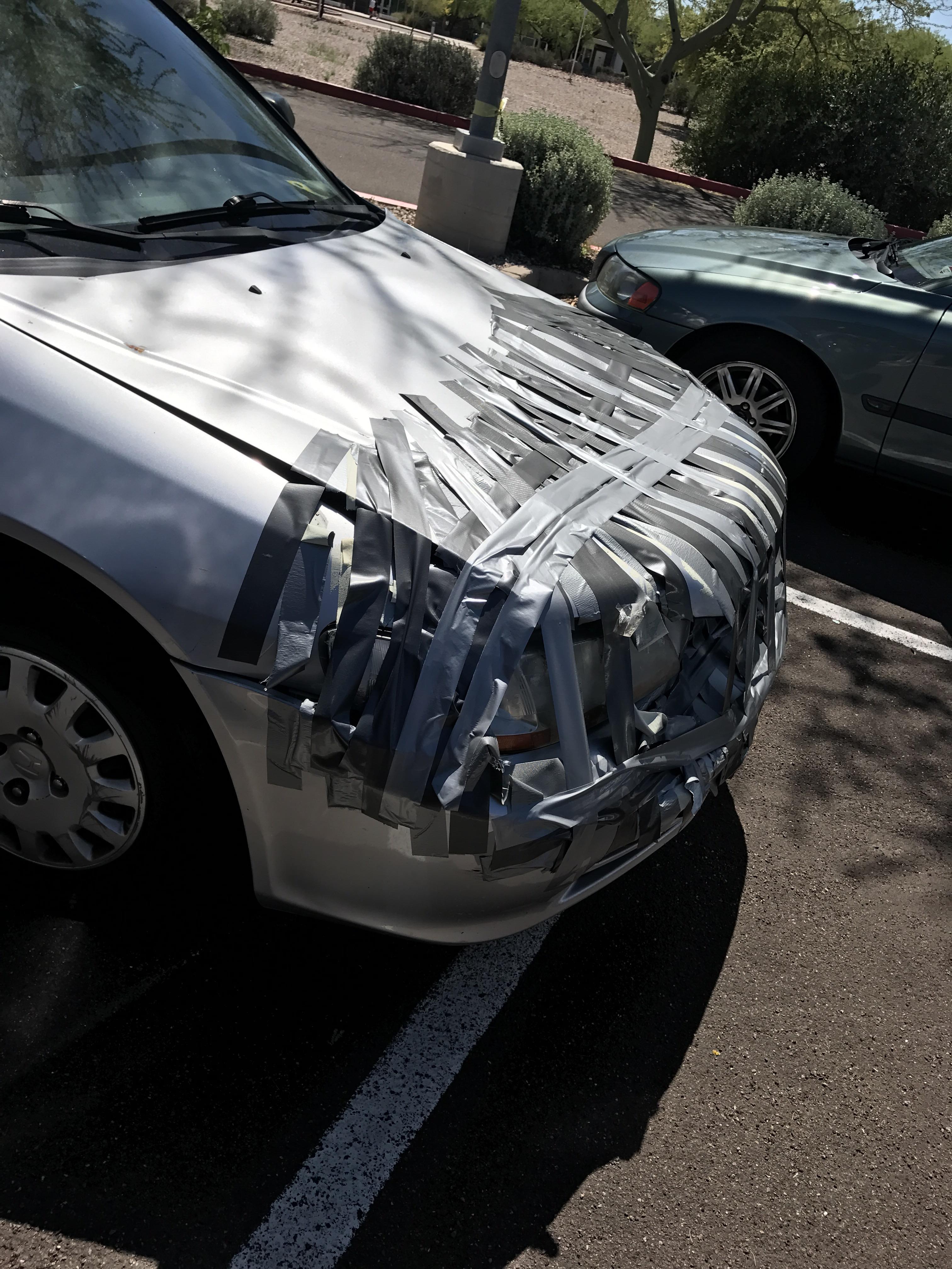 This bumper held on by duct tape. r/mildlyinteresting