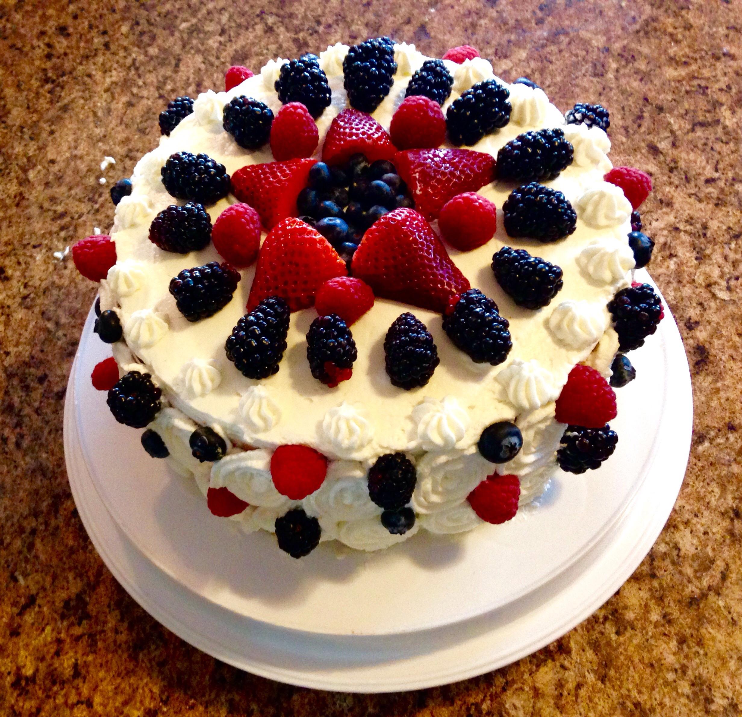 Tres Leches Cake with Mixed Berry Compote and Cream Cheese Filling and