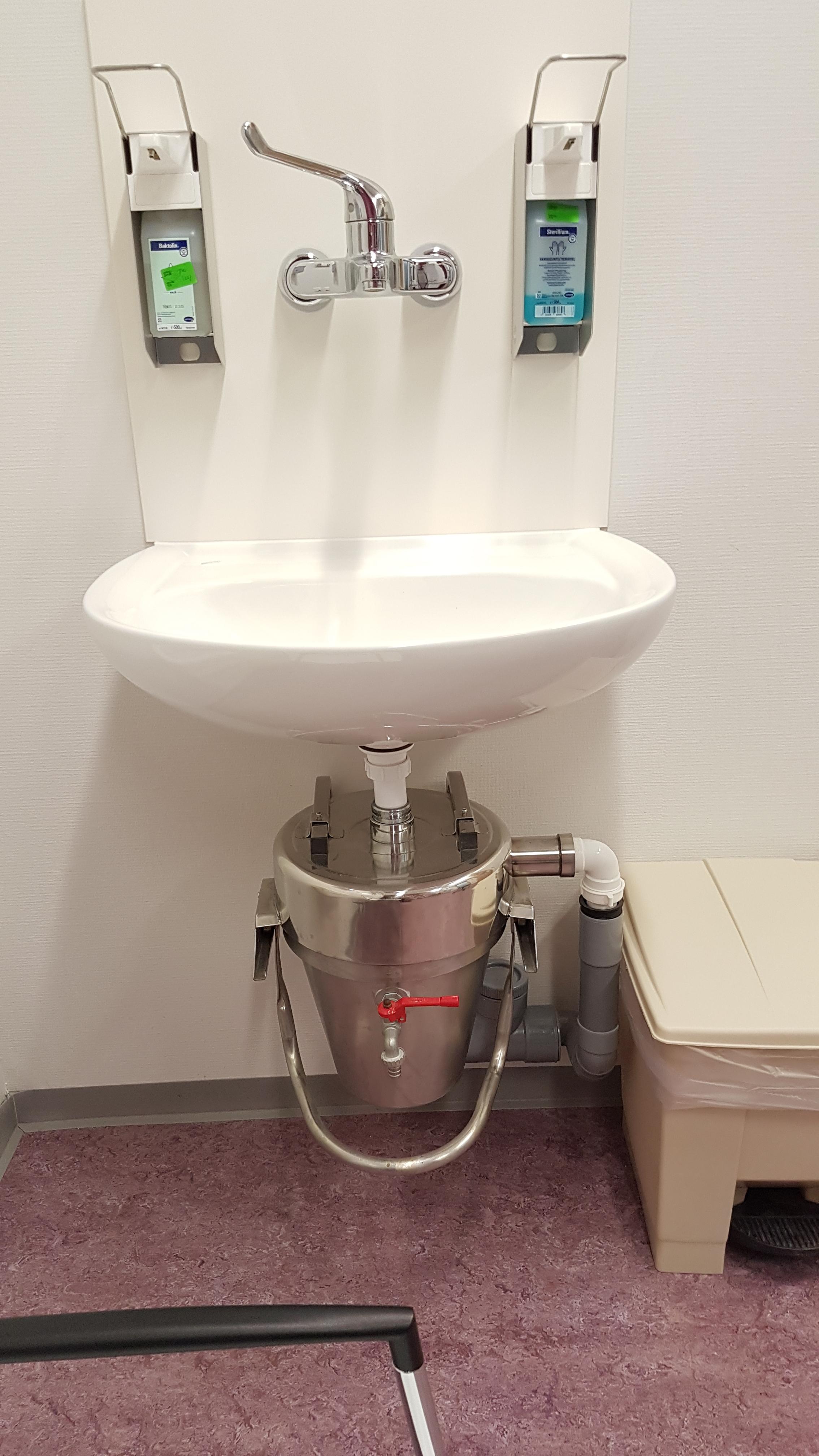 Mounted under a sink in the trauma room of an hospital