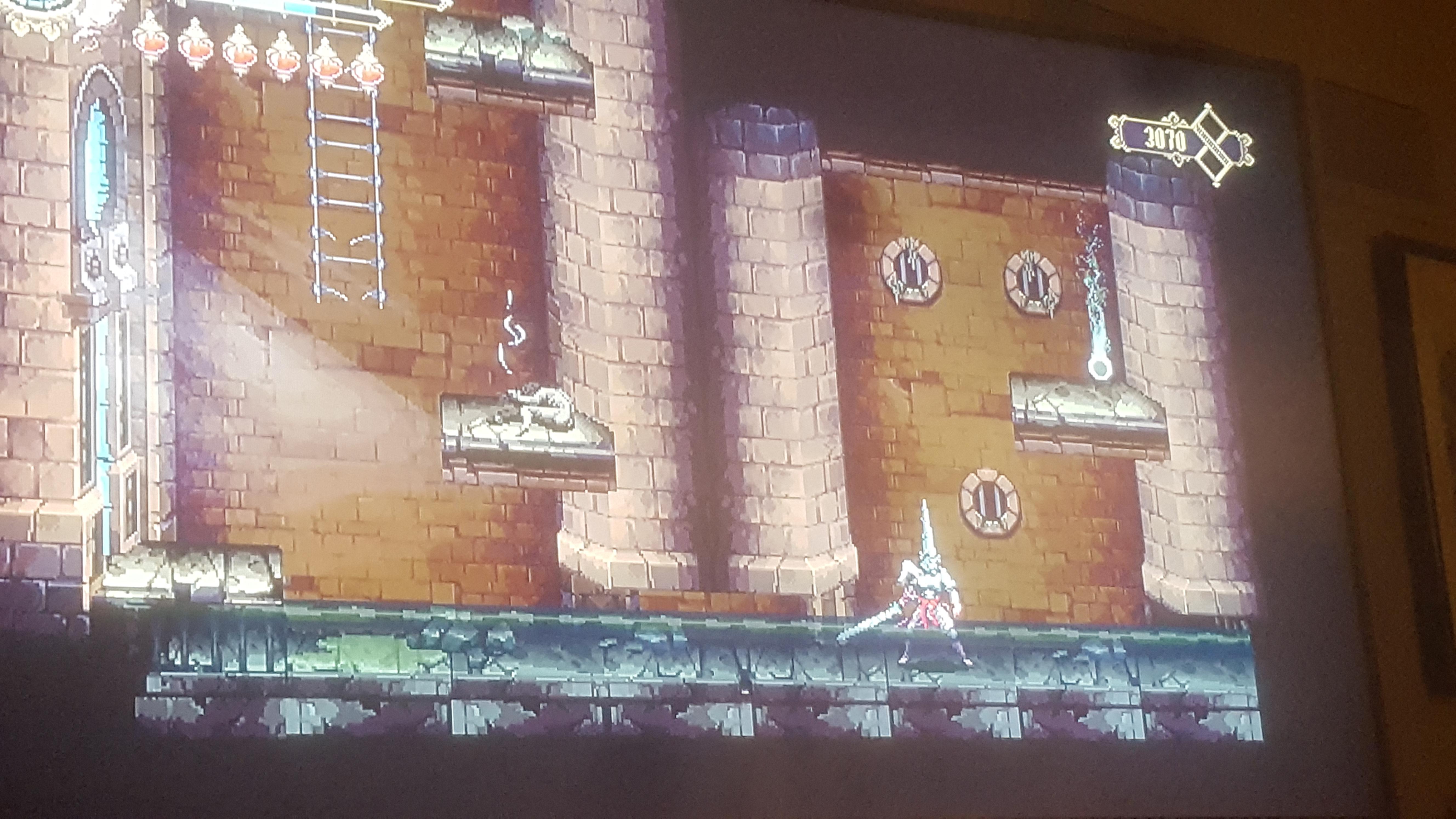 How do I reach this item? The water sucks me down so I can't jump up to