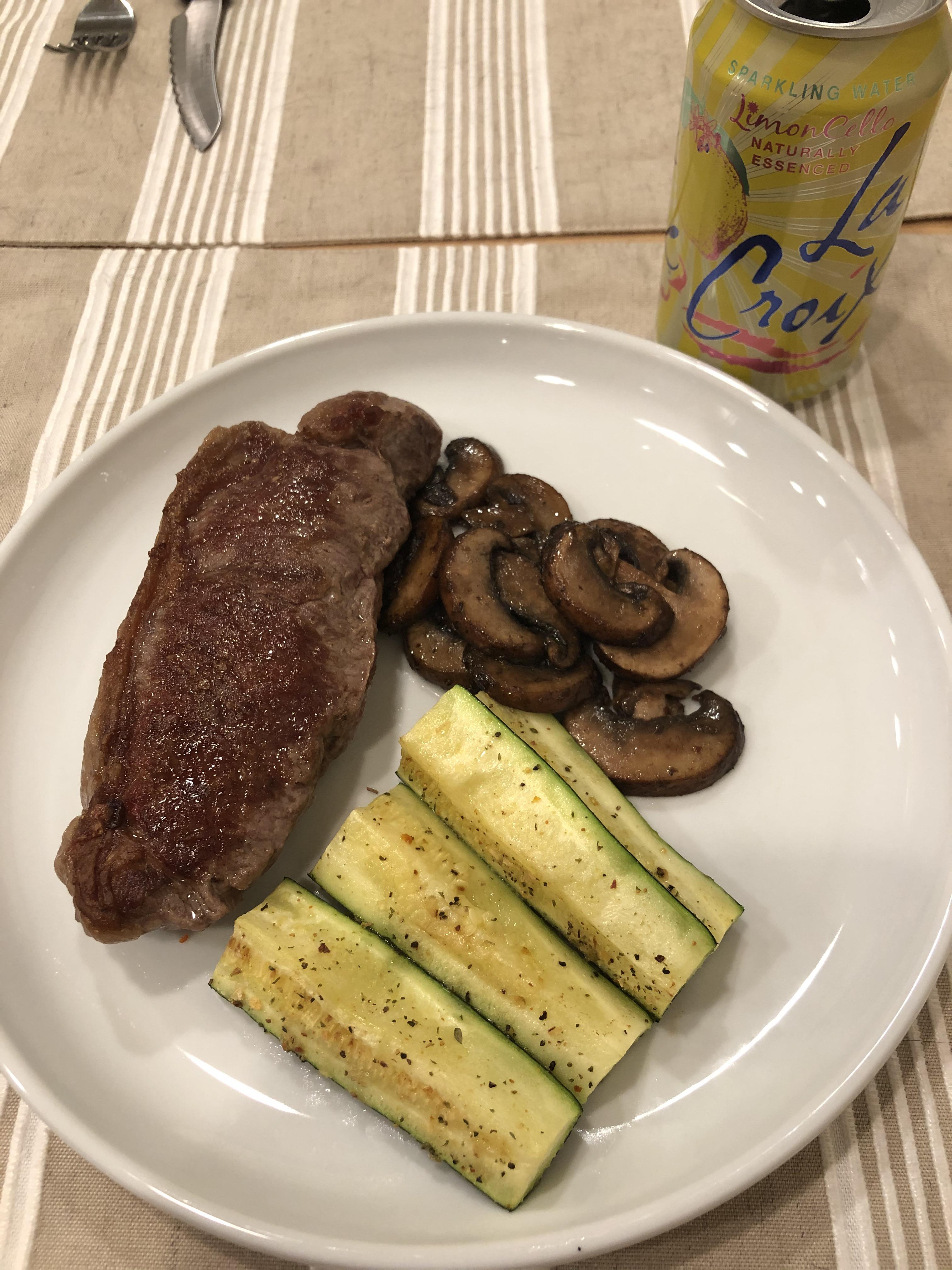 NY Strip Steak, baby Bella mushrooms cooked in the ghee left from the