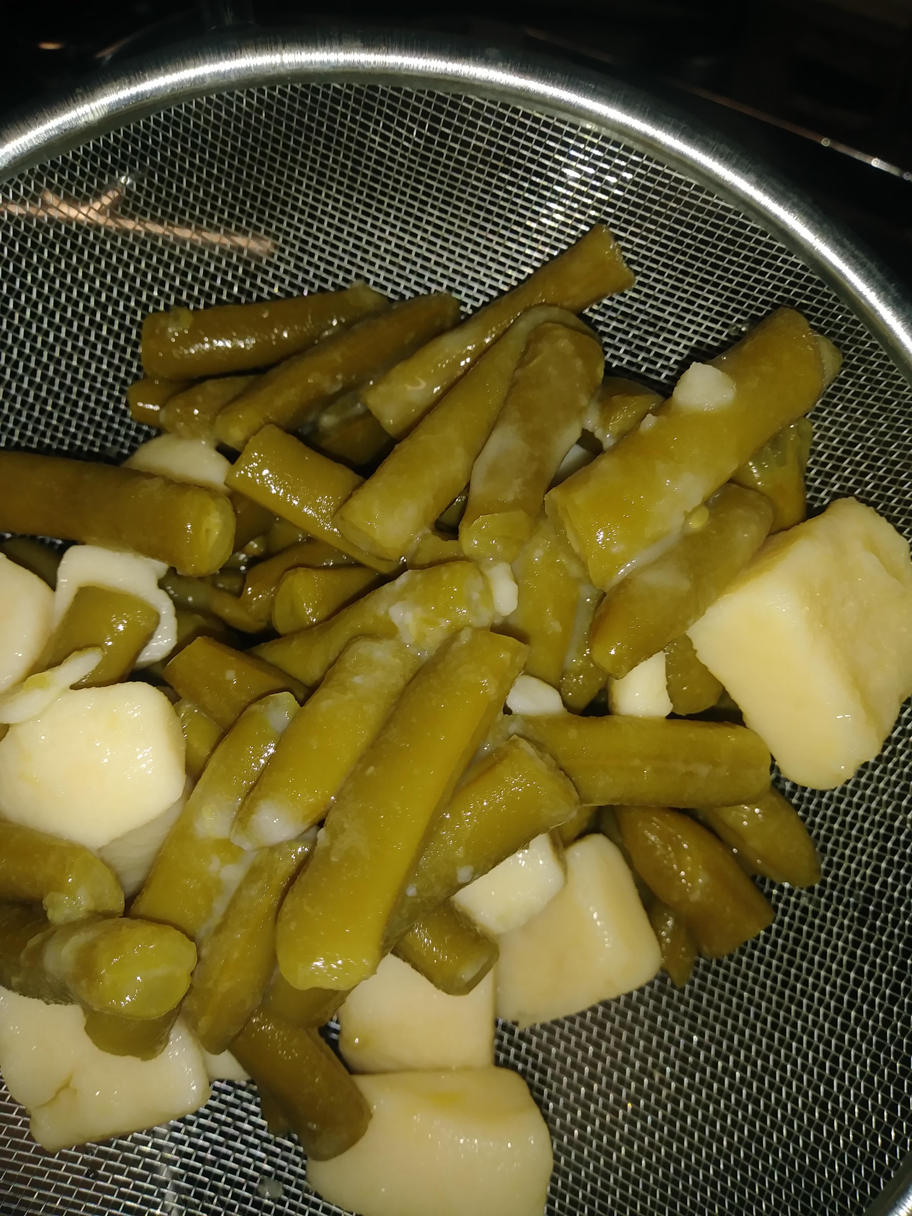 Opened a can of green beans and potatoes and there's this white slimy residue on them and on the