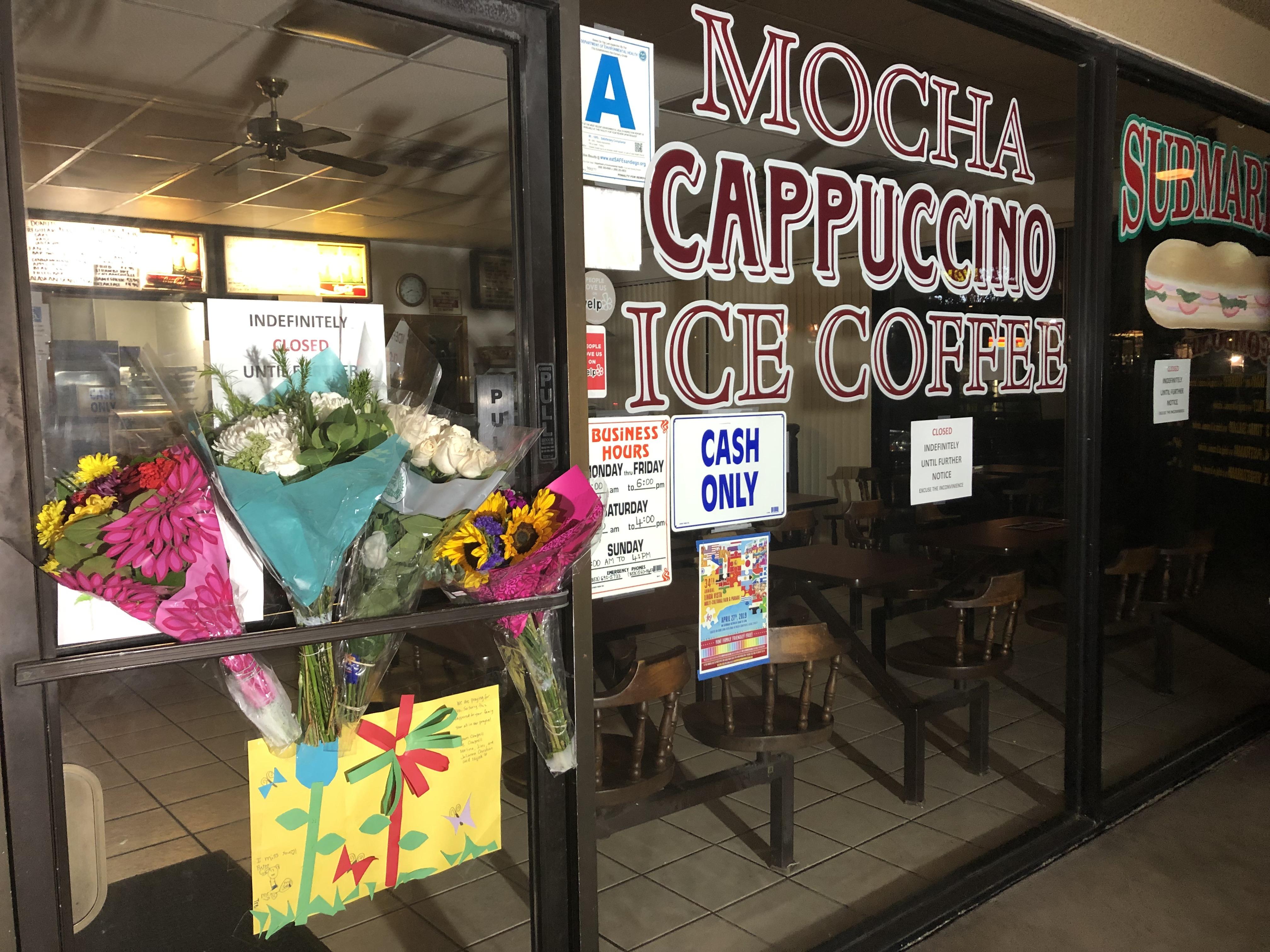 Flowers left at Rose Donuts on Linda Vista Rd. after owner was attacked