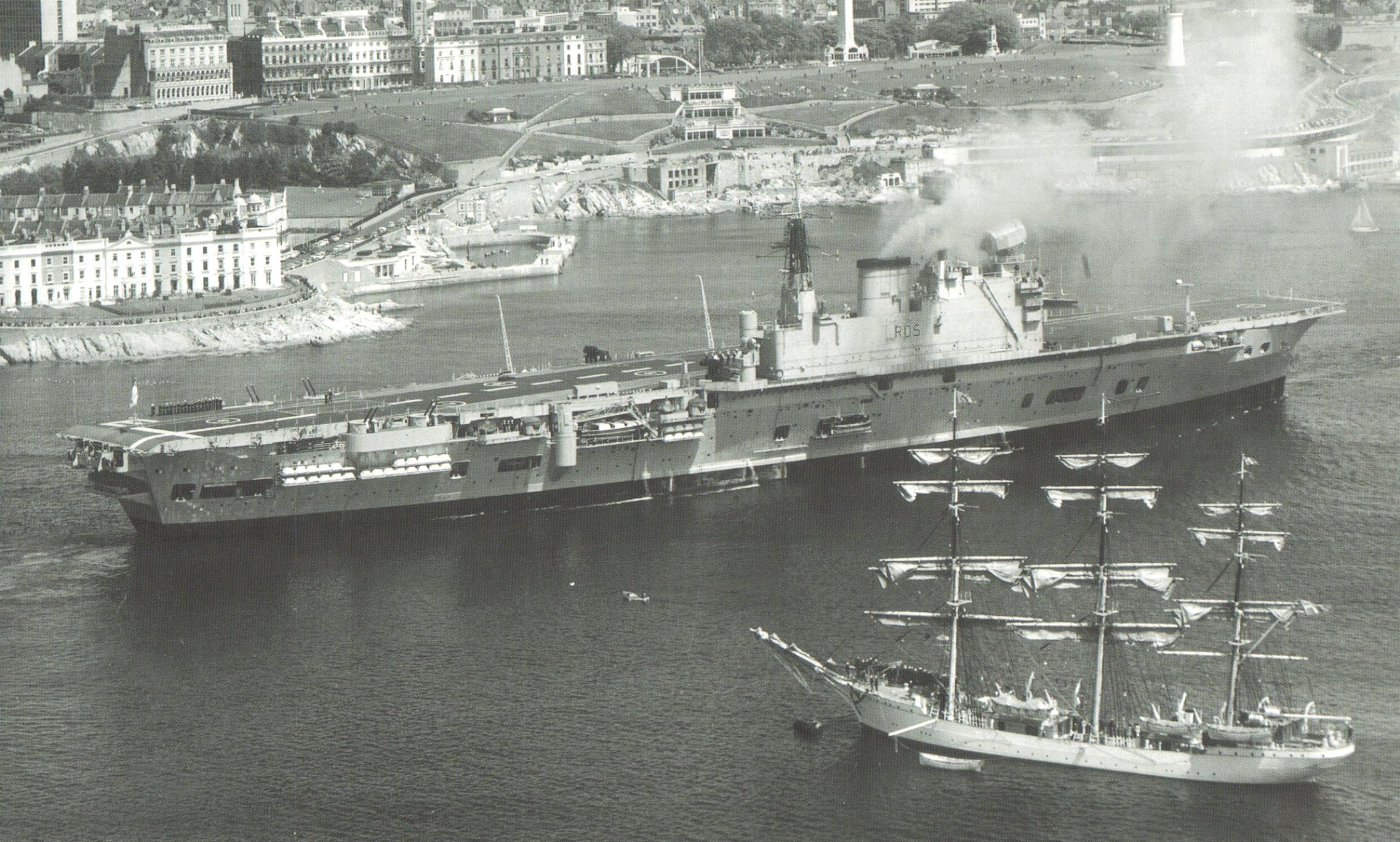 HMS Eagle (R05) passes a sailing ship in Plymouth Sound, 1970. [2184 x