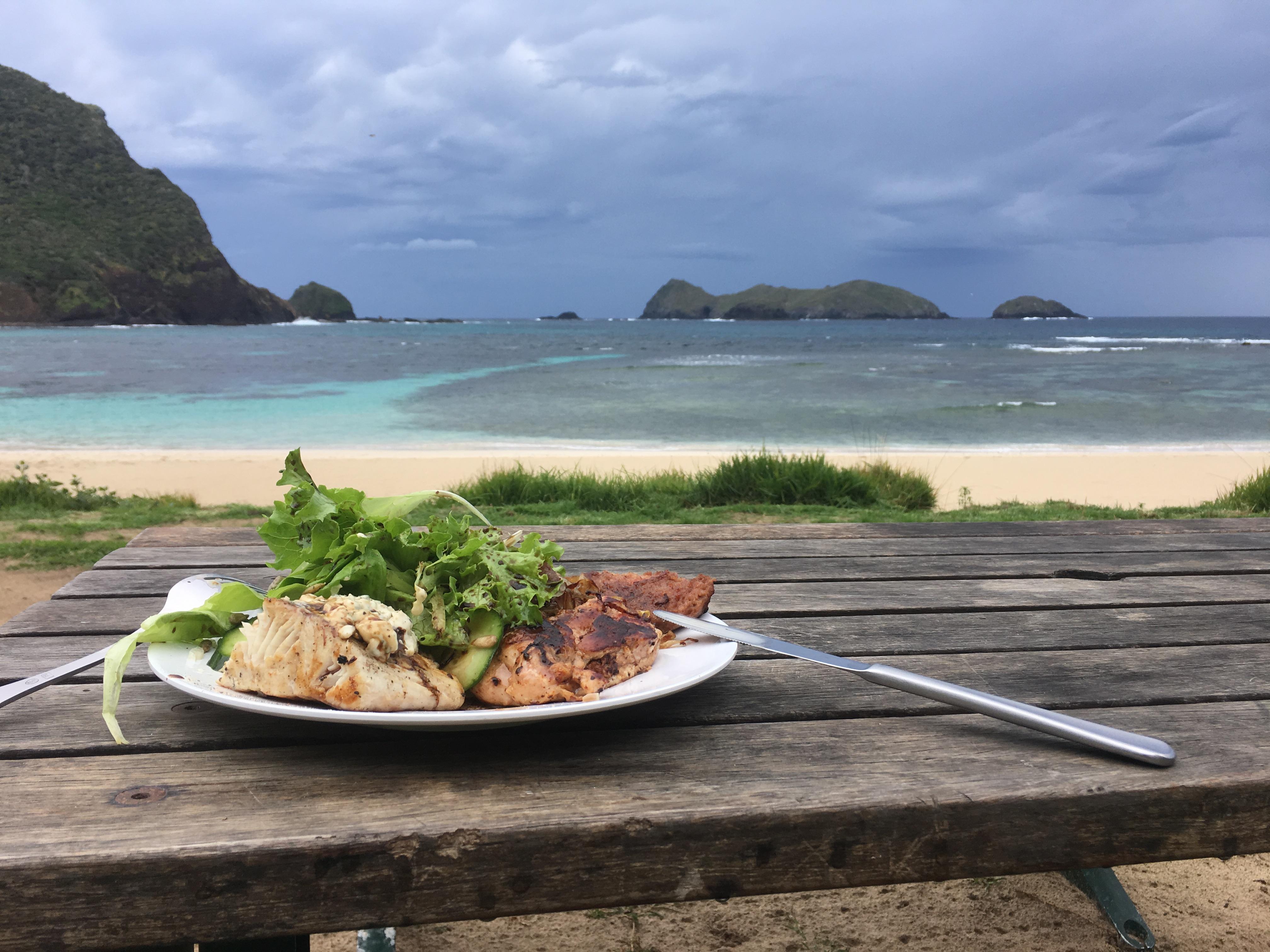 Woodfired BBQ kingfish and Thaimarinate chicken thighs with salad on