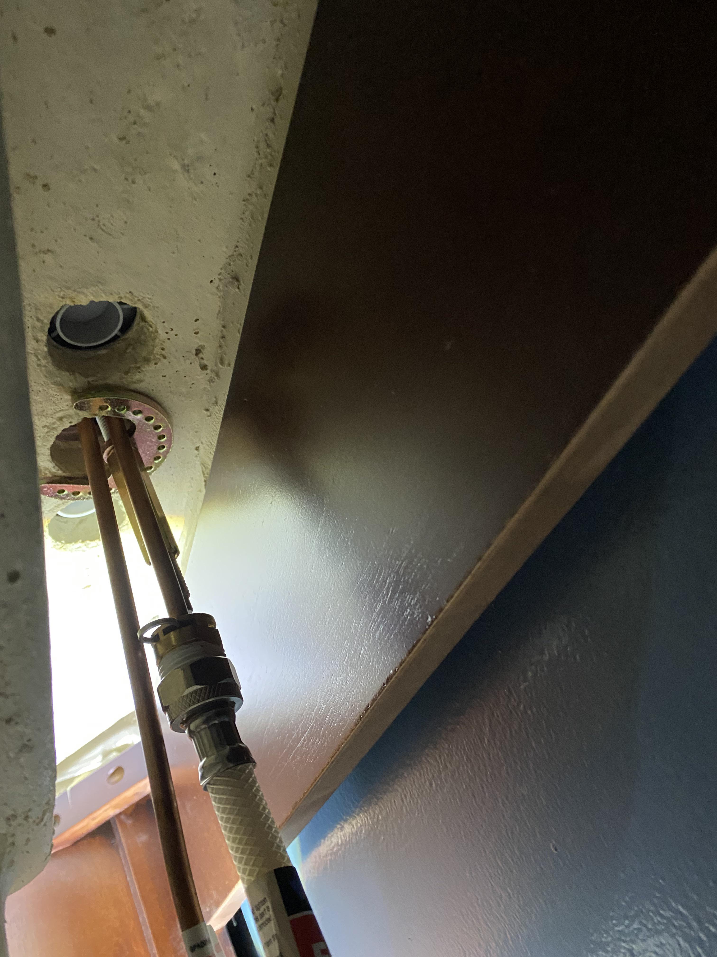 How do I remove this ‘horseshoe’ connection? It is underneath the sink