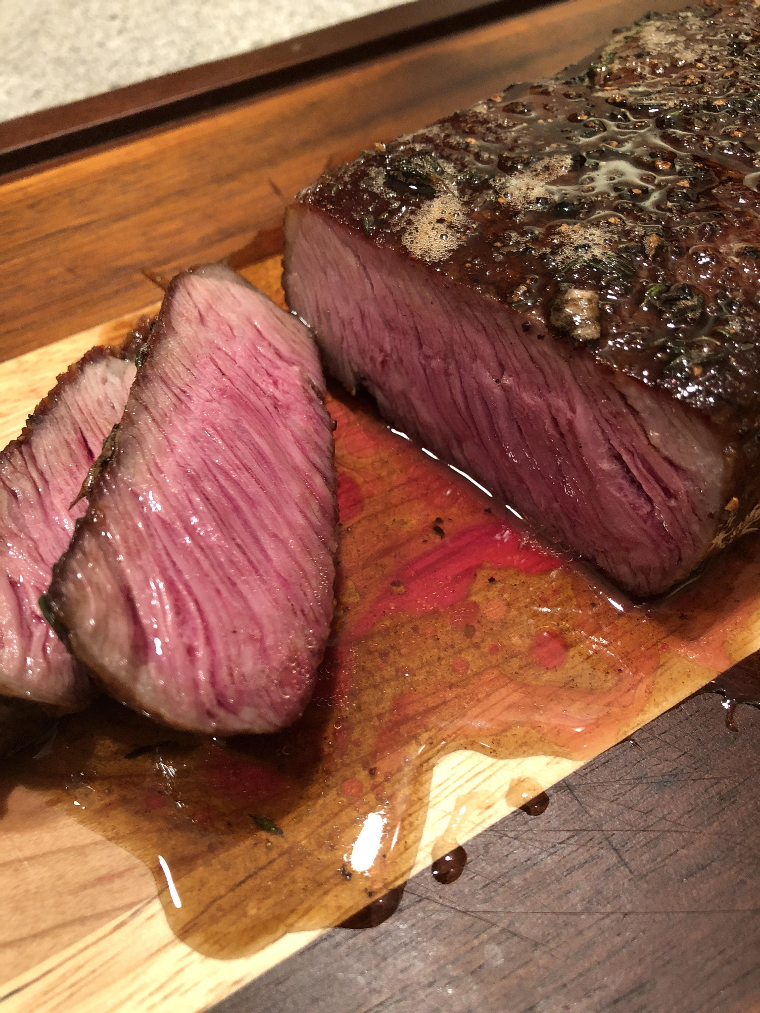 USDA Prime NY Strip. Cast ironed. Butter and Thyme basted. r/steak