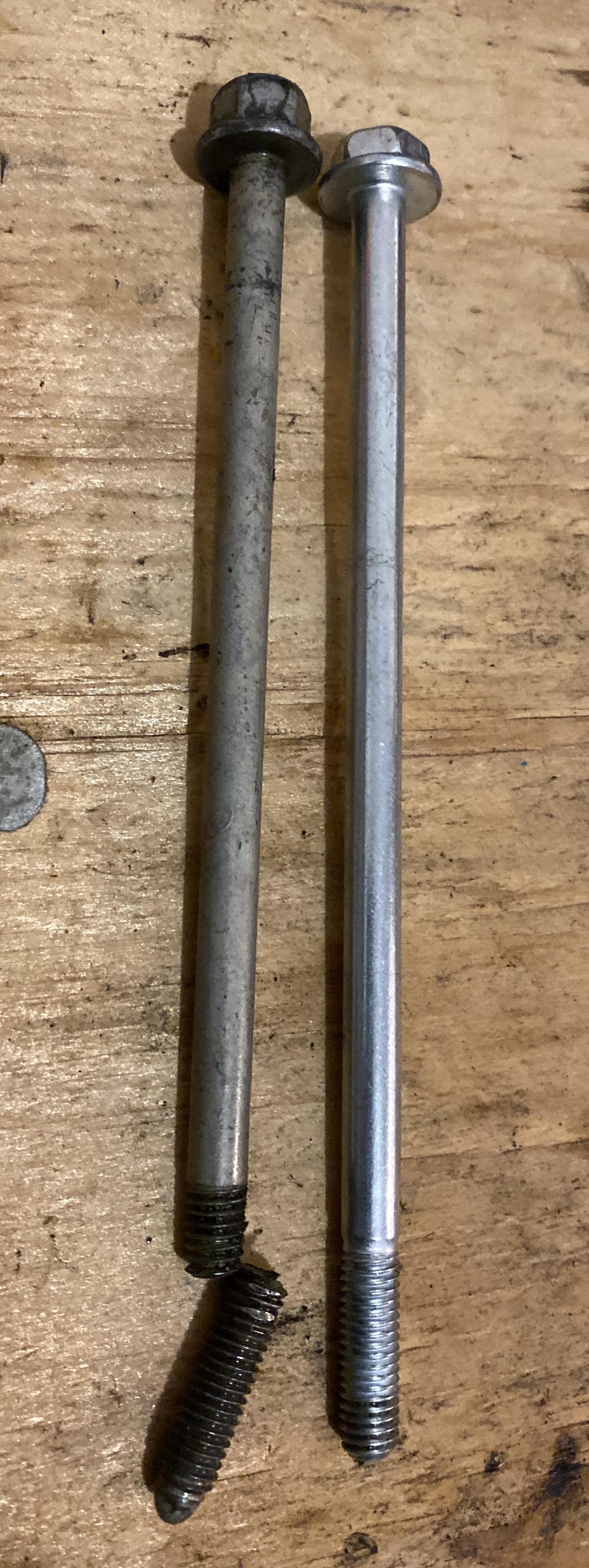 Crappy oil pan bolt from a Chevy LS engine. New for comparison. r