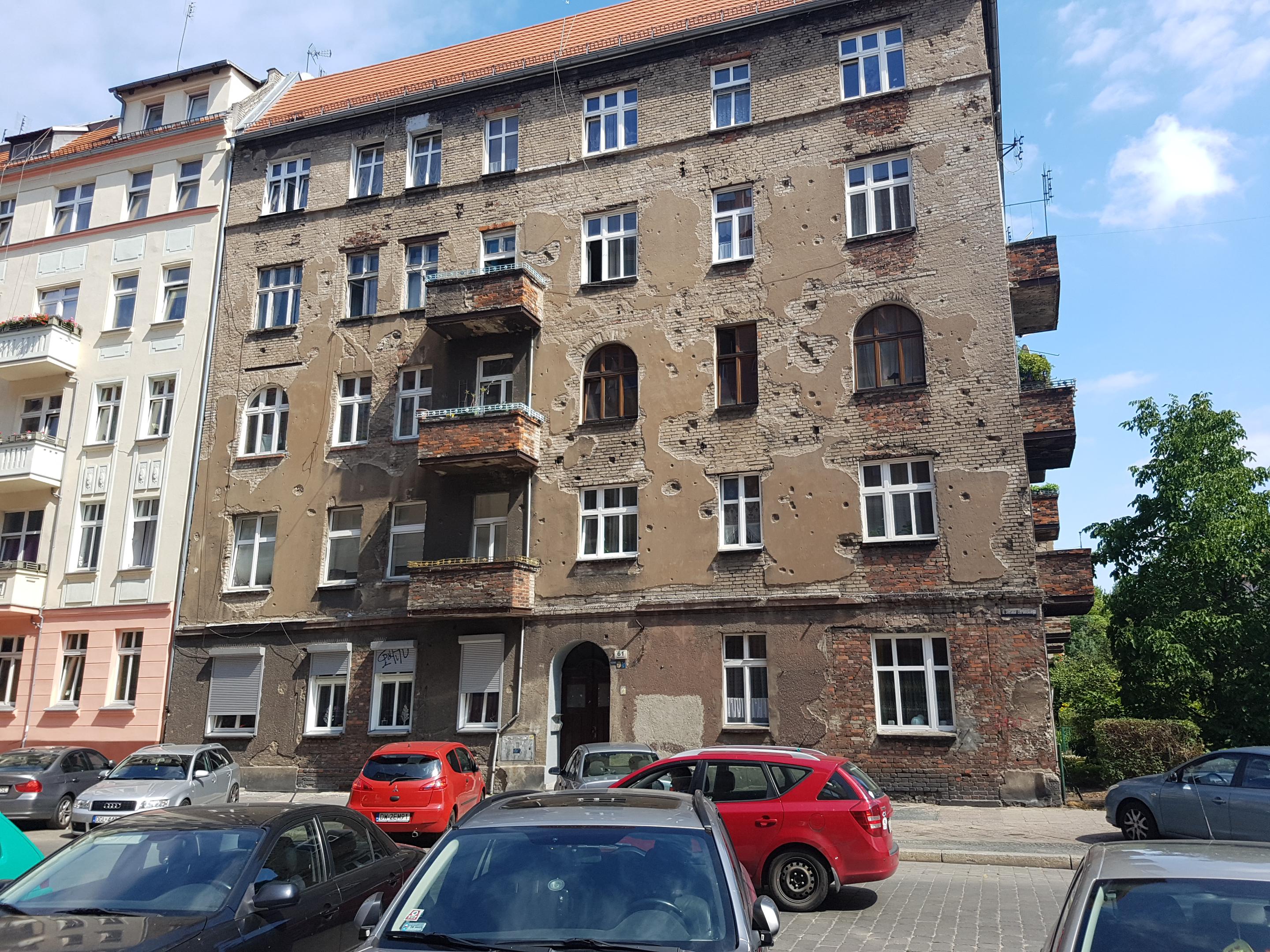 A tenement house in Wrocław, Poland still has bullet holes from WW2 in