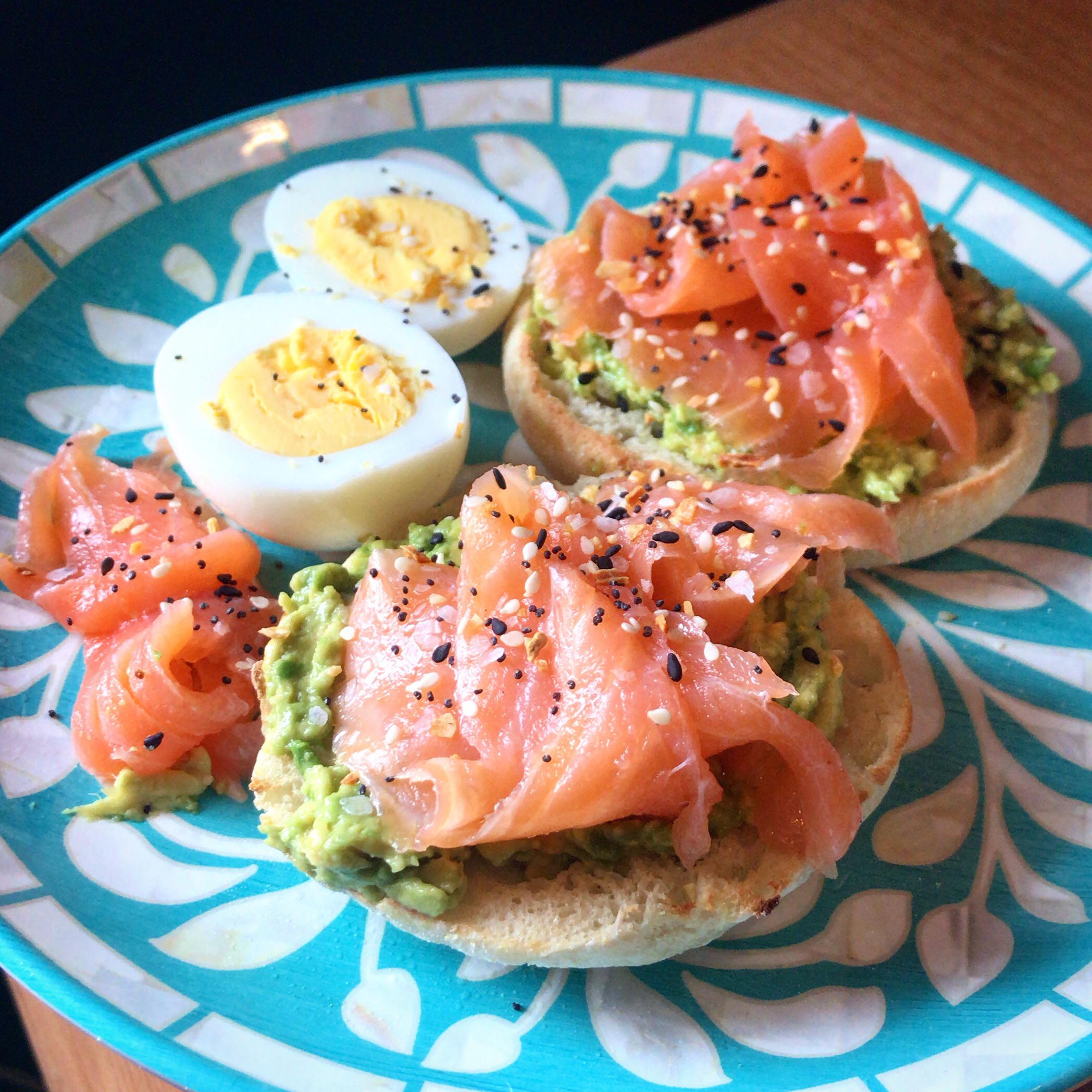 English muffin topped with avocado, smoked salmon, everything bagel