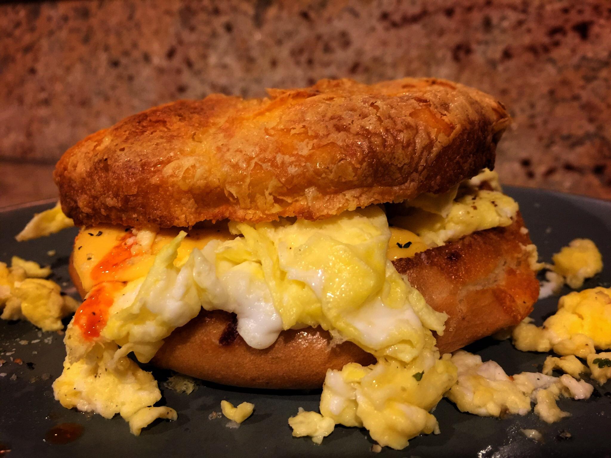 Free range eggs, cheese bagel, cheese, hot sauce. r/PutAnEggOnIt