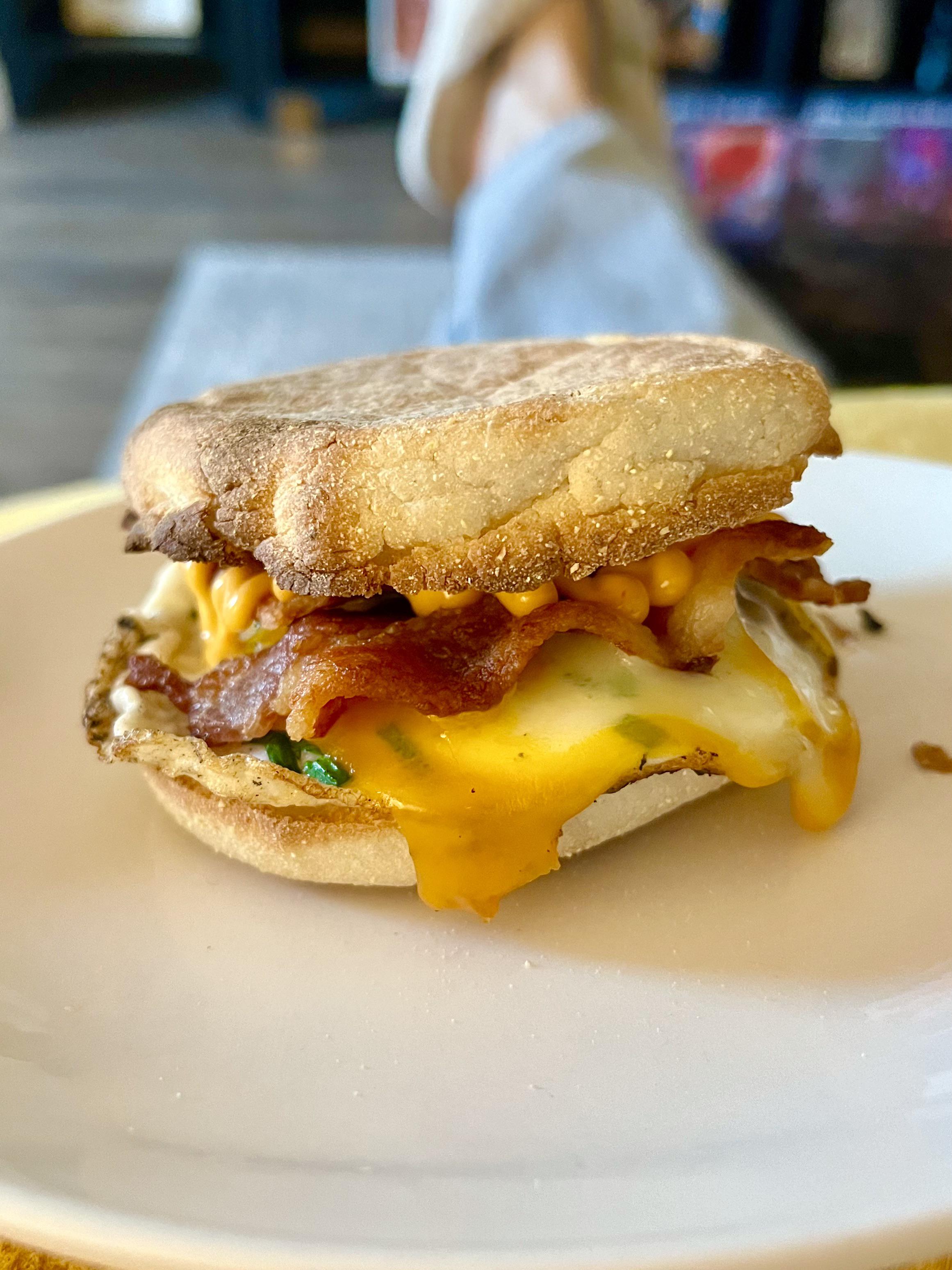 [Homemade] bacon, egg, and cheese breakfast sandwich on an English