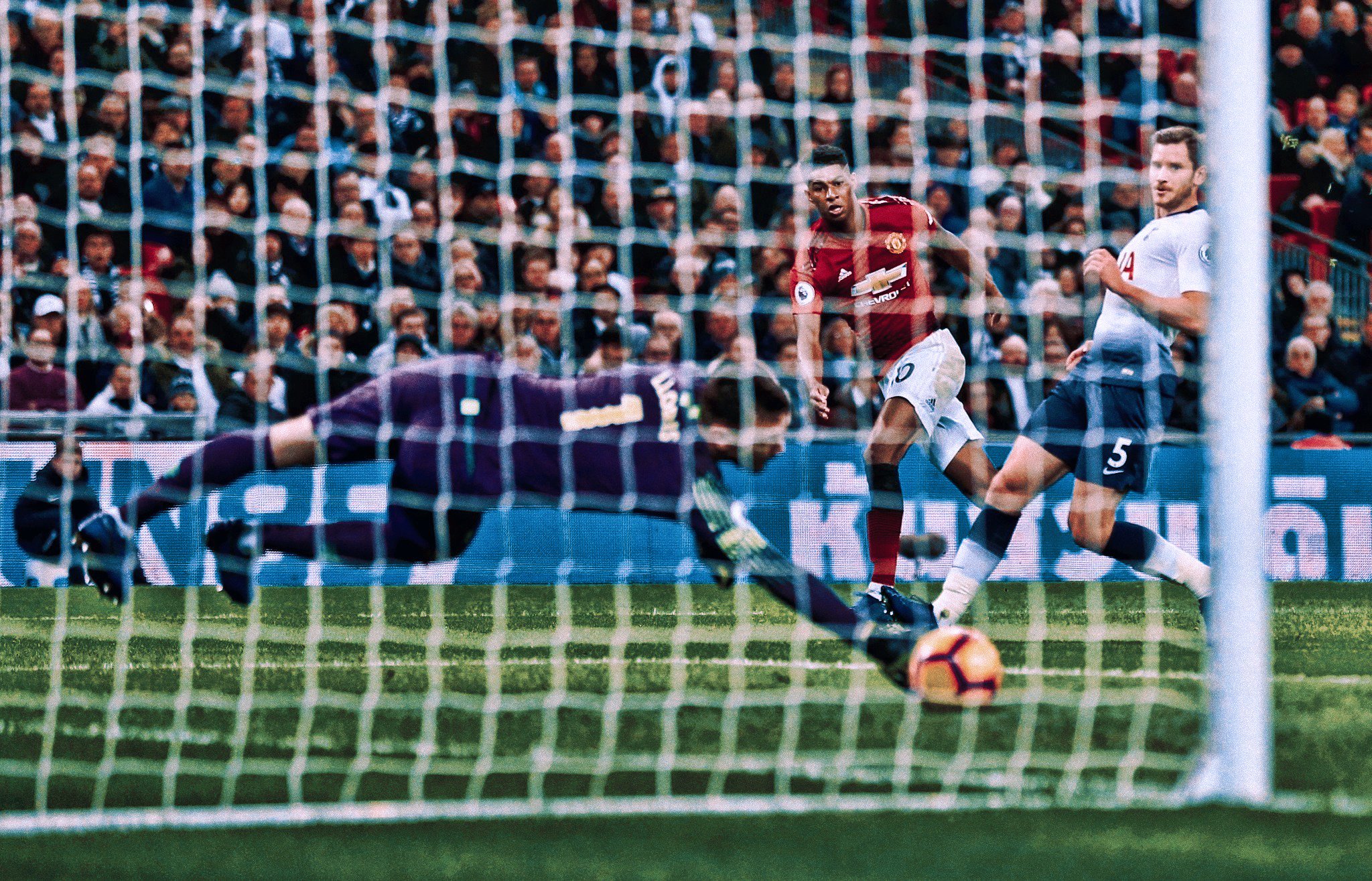 From Wythenshawe and loves to fightHe's born to play, in red and