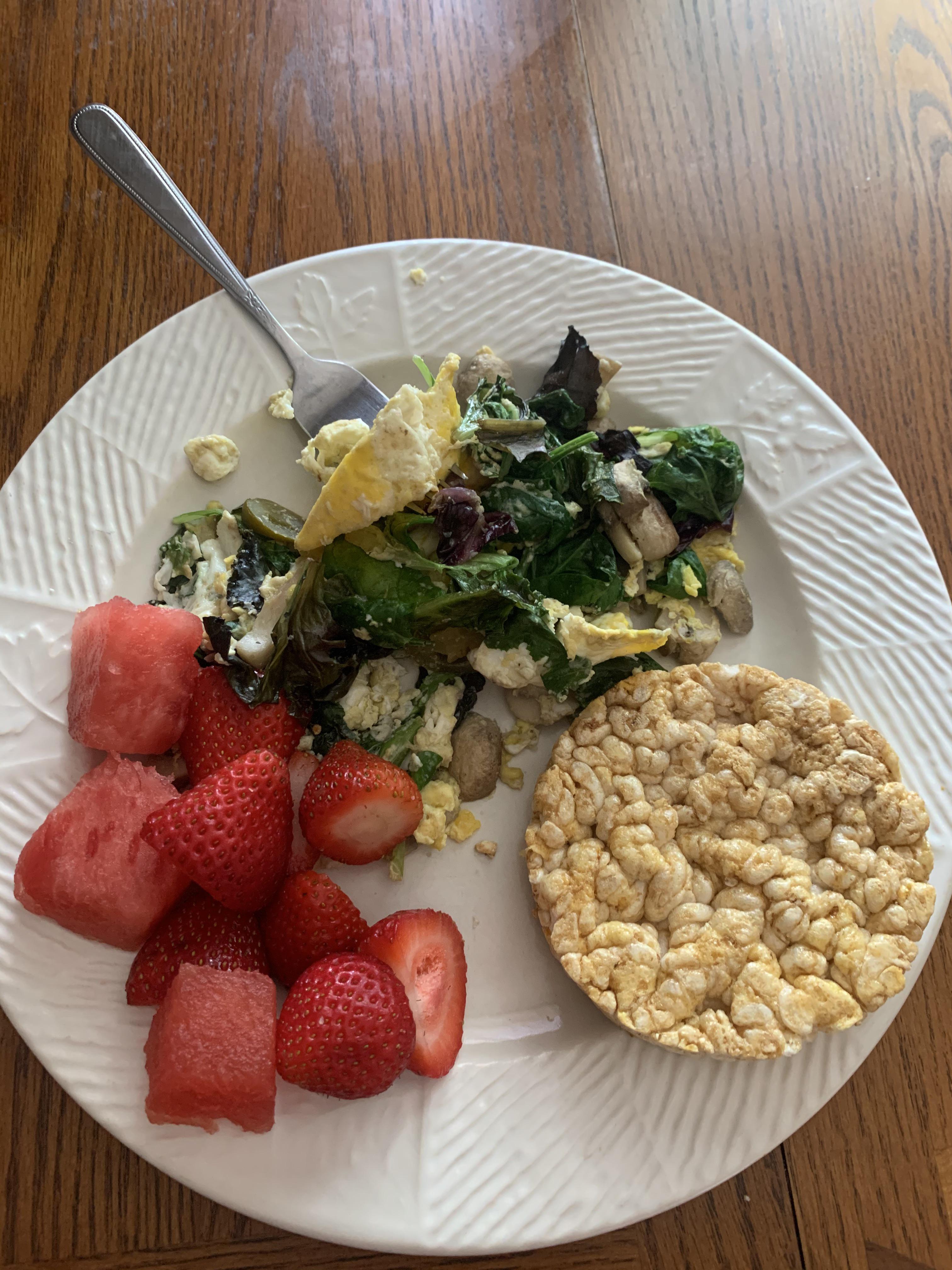 Little post workout meal—Eggs, spinach, mushrooms, fruit & a rice cake
