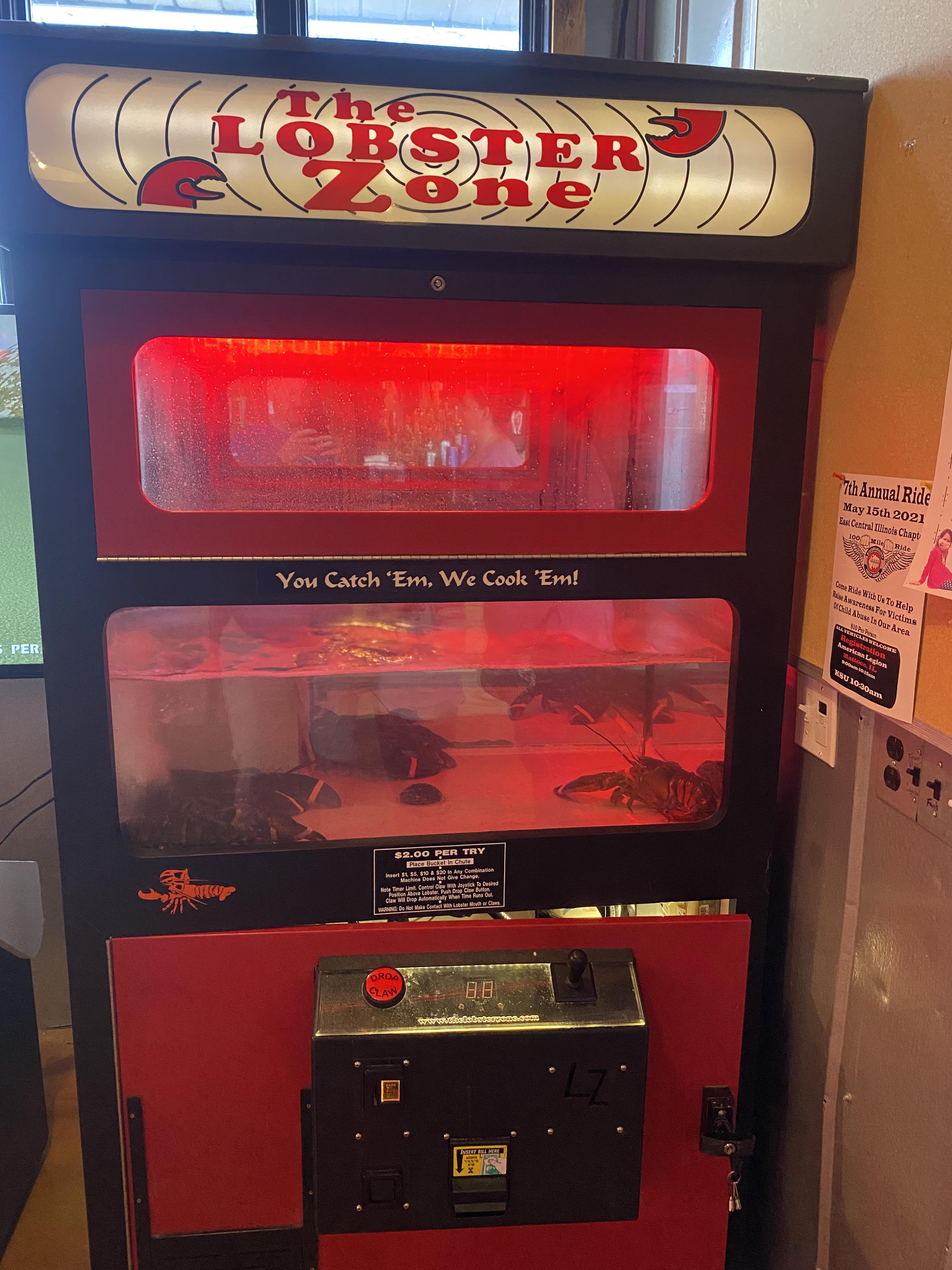 A lobster claw machine at the bar. Get a lobster, eat a lobster. r