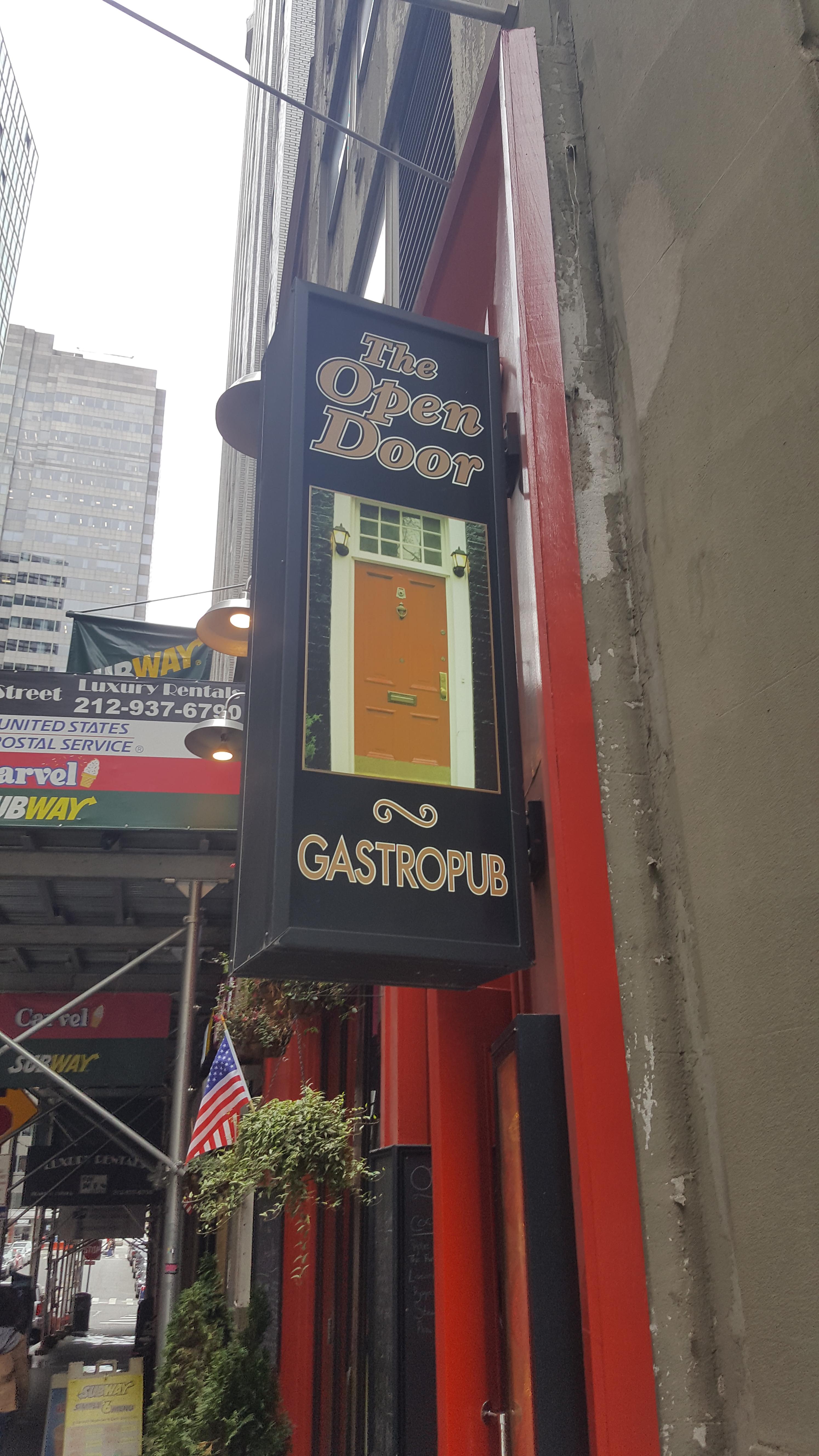 Open Door pub sign is a closed door. CrappyDesign