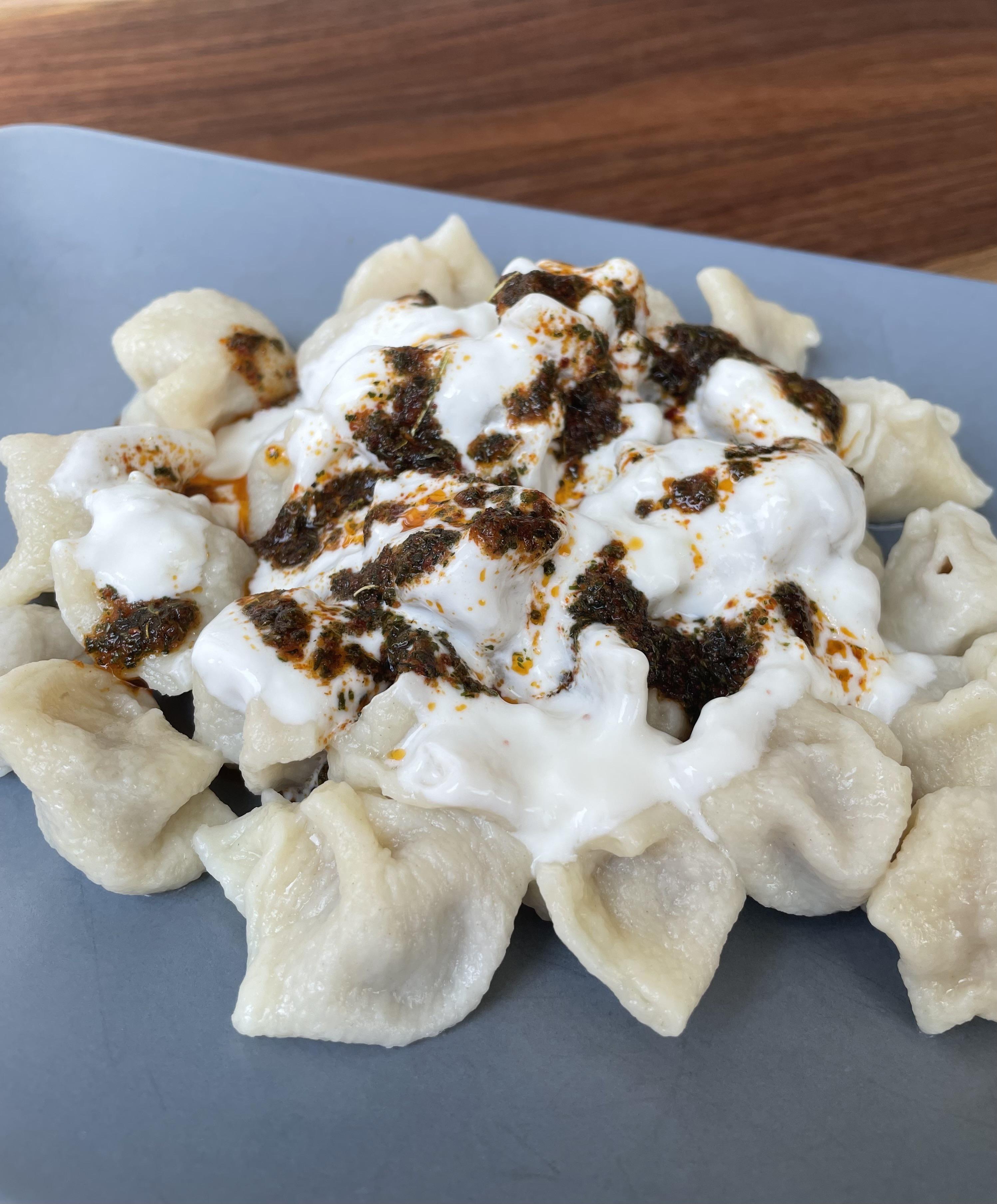 Turkish Dumplings with garlic yogurt sauce. Recipe in comments r/FoodPorn
