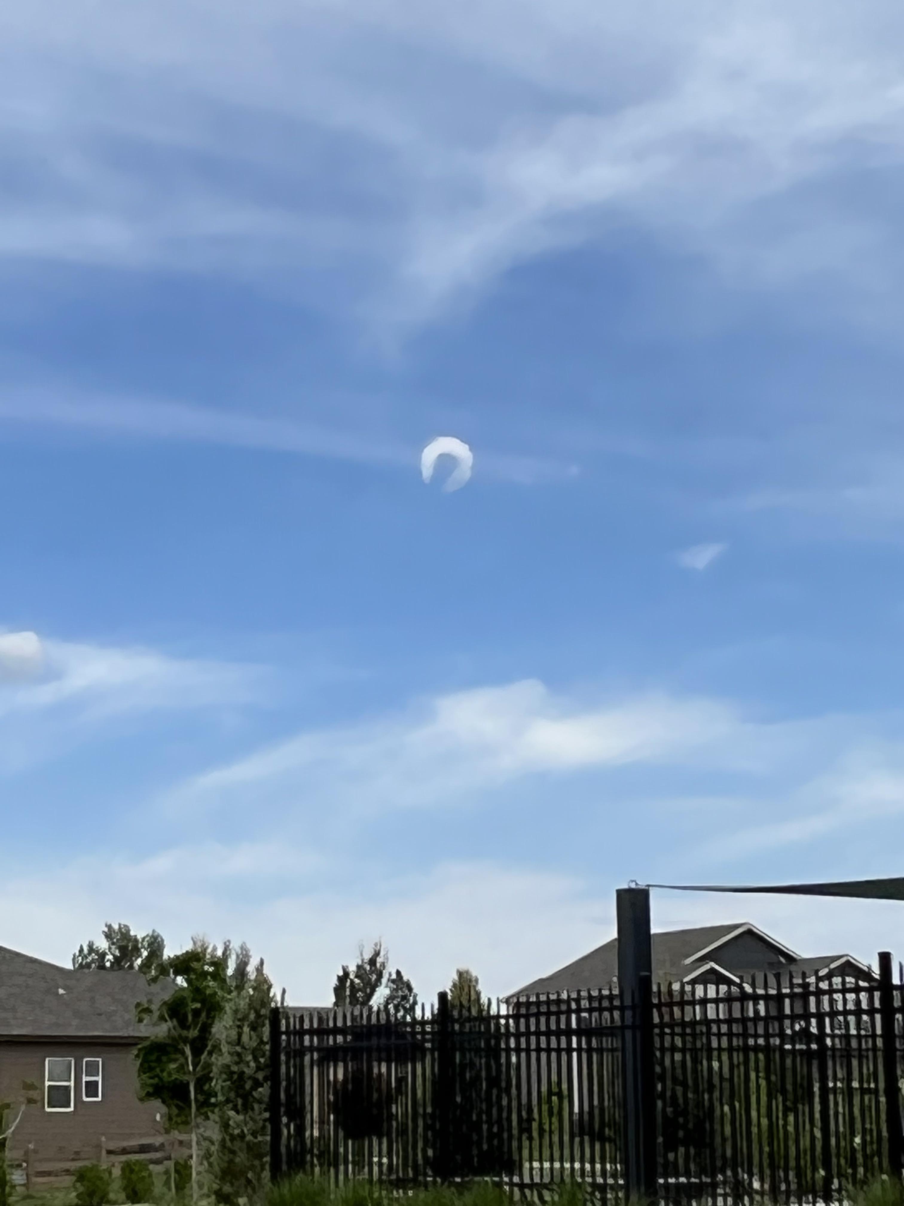 Odd horseshoe shaped cloud. It’s one of the strangest clouds I’ve seen