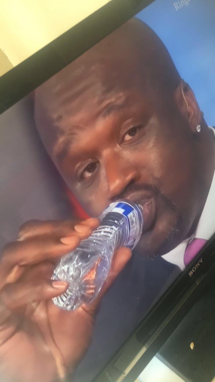 Shaq makes the water bottle look like it's kid size. funny