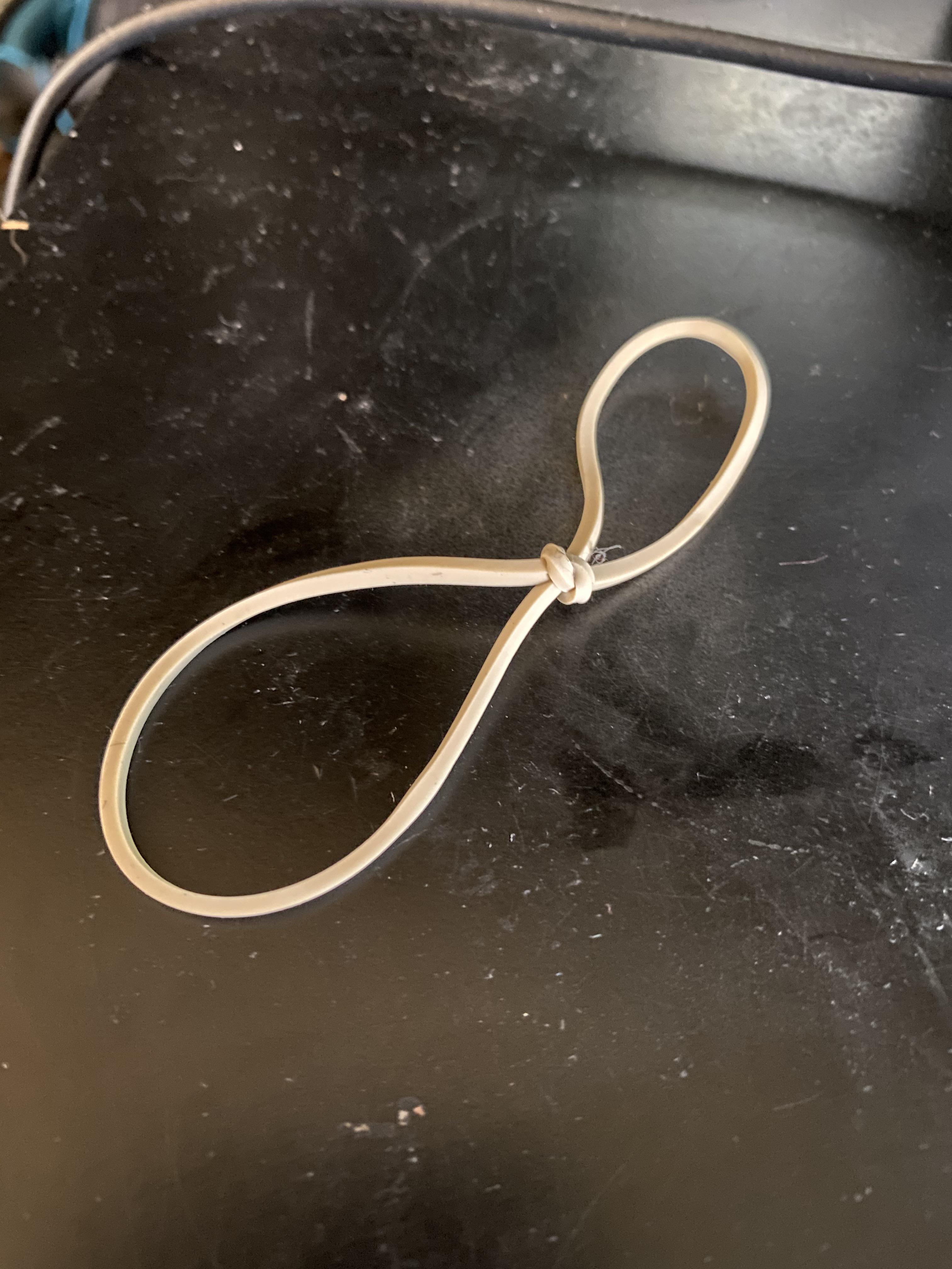 This rubber band is in a knot, because I tied it into one. r