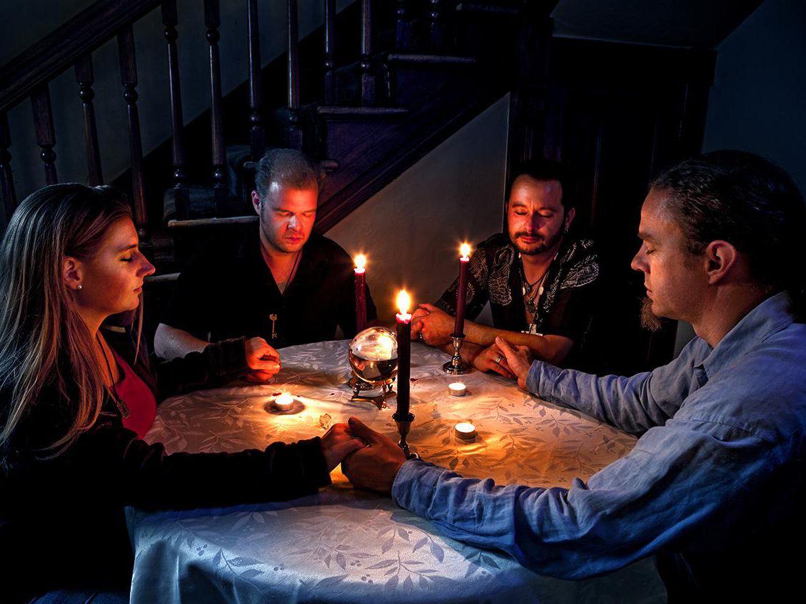 Local Denver family lights pig fat candles, rubs goat blood on walls