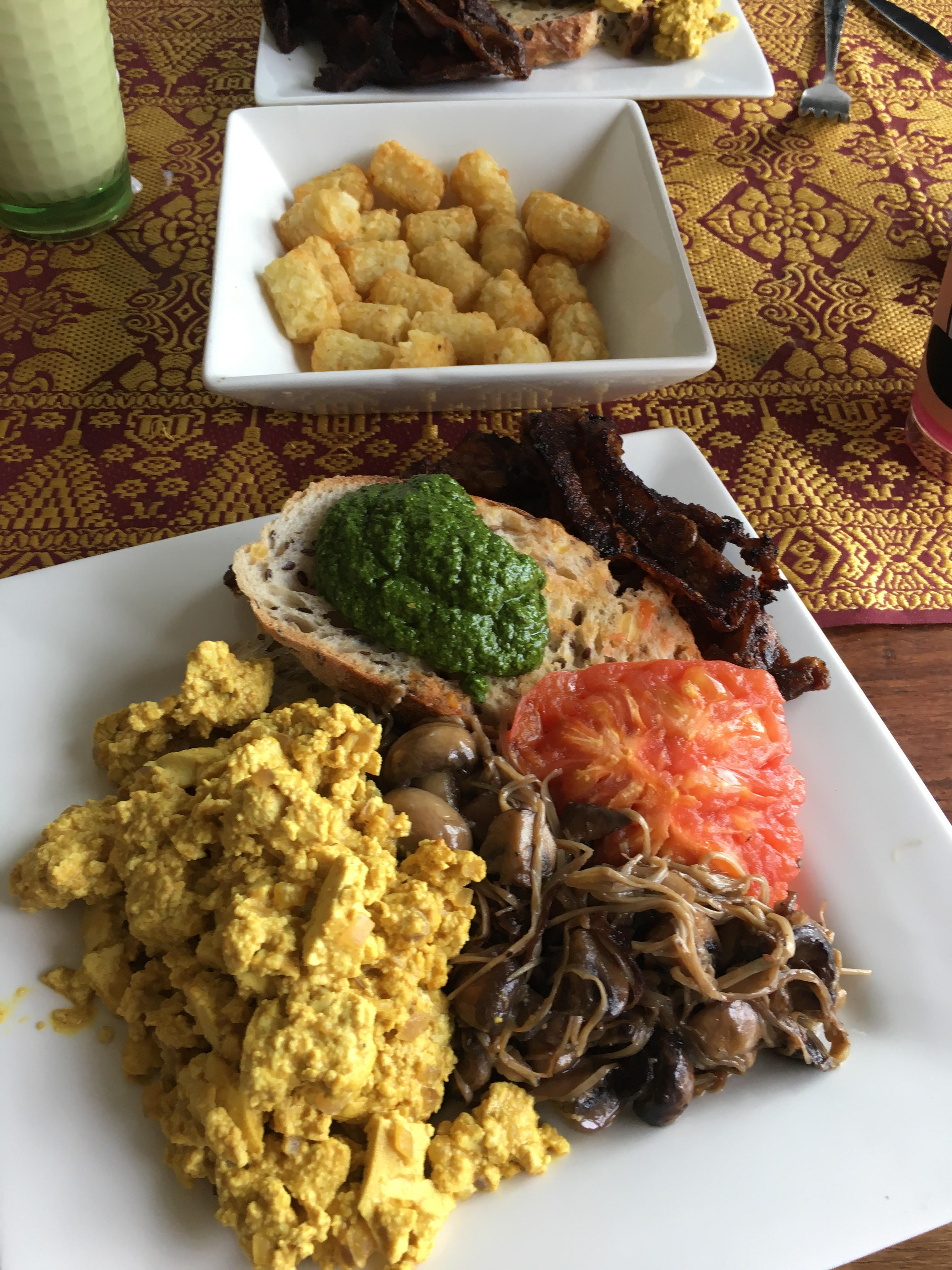 Homemade breakfast fry up scrambled tofu, rice paper bacon, mushrooms