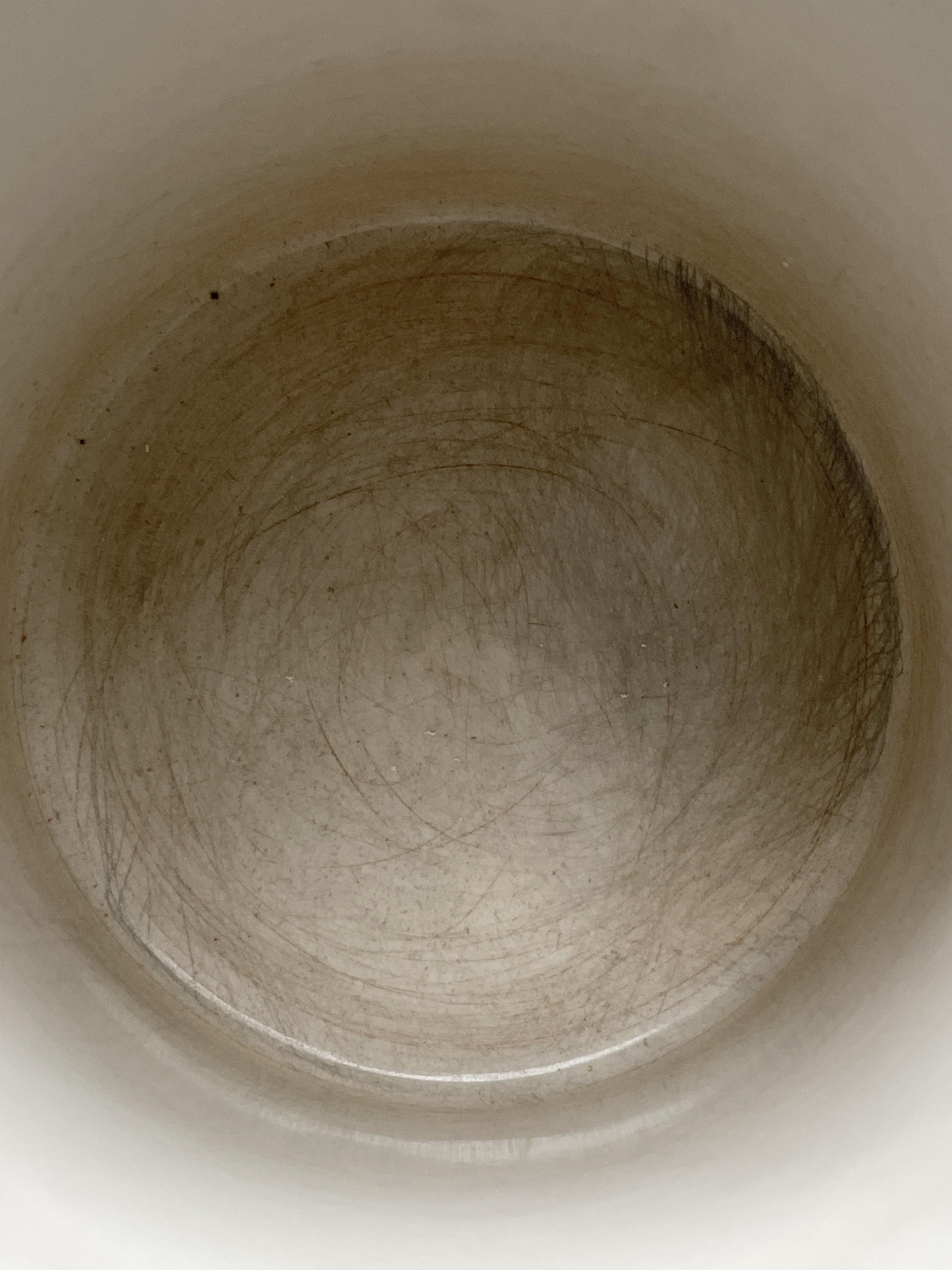 Would you use a thrifted mug that’s scratched like this? Scrubbed with