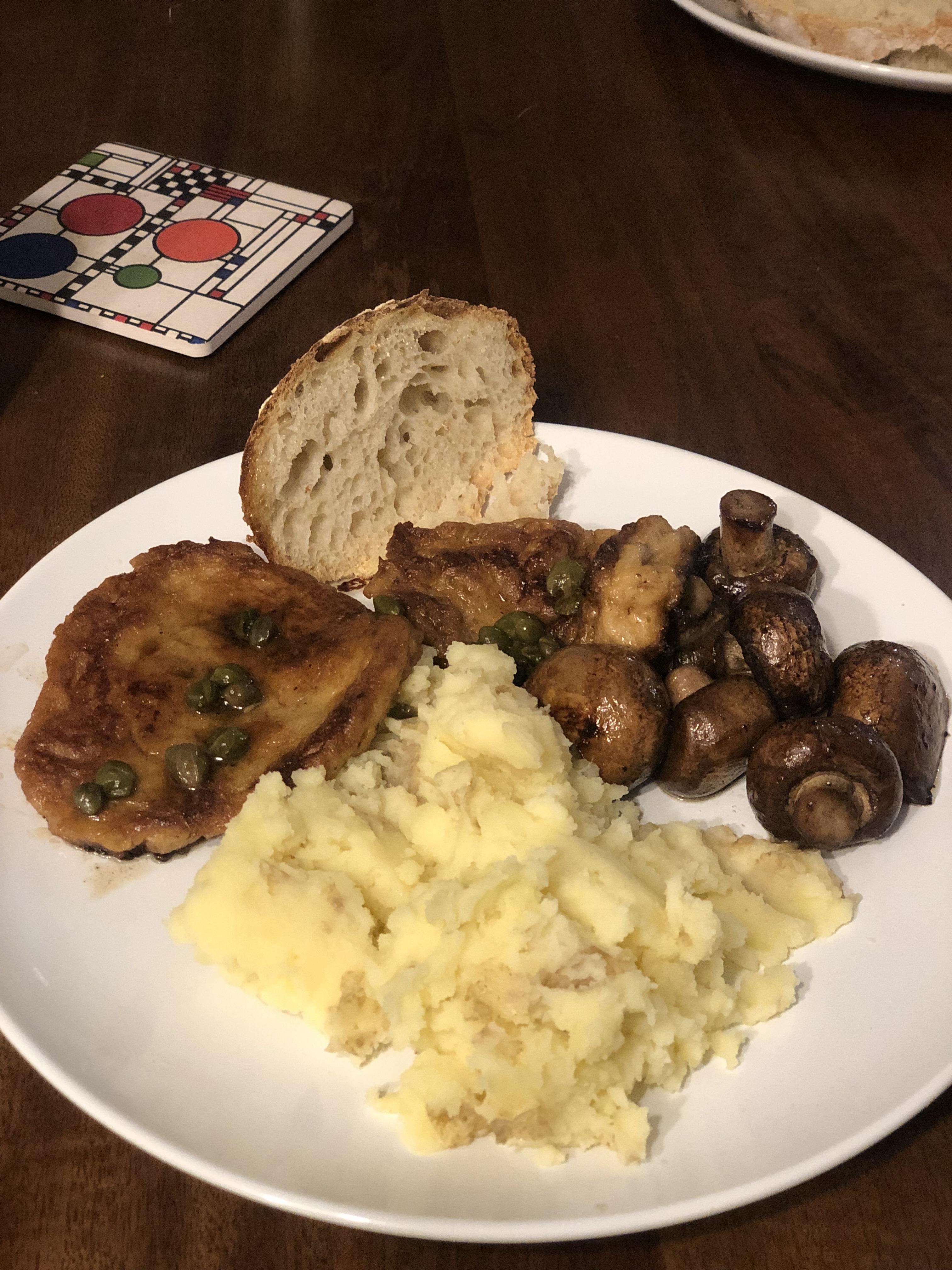 Homemade seitan piccata with homemade sourdough, mashed potatoes and a