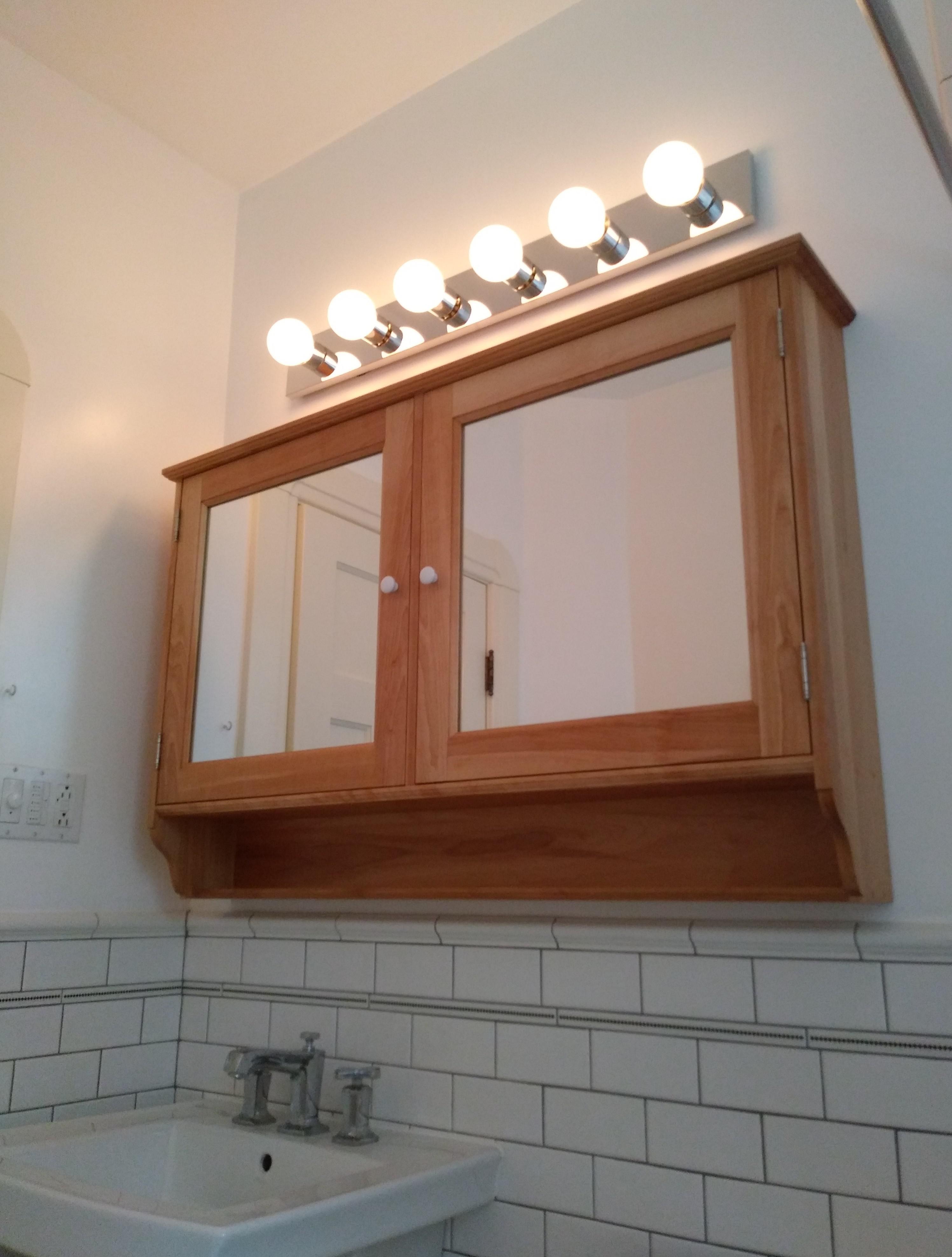 Simple solid wood wall for a bathroom. What do you think? r