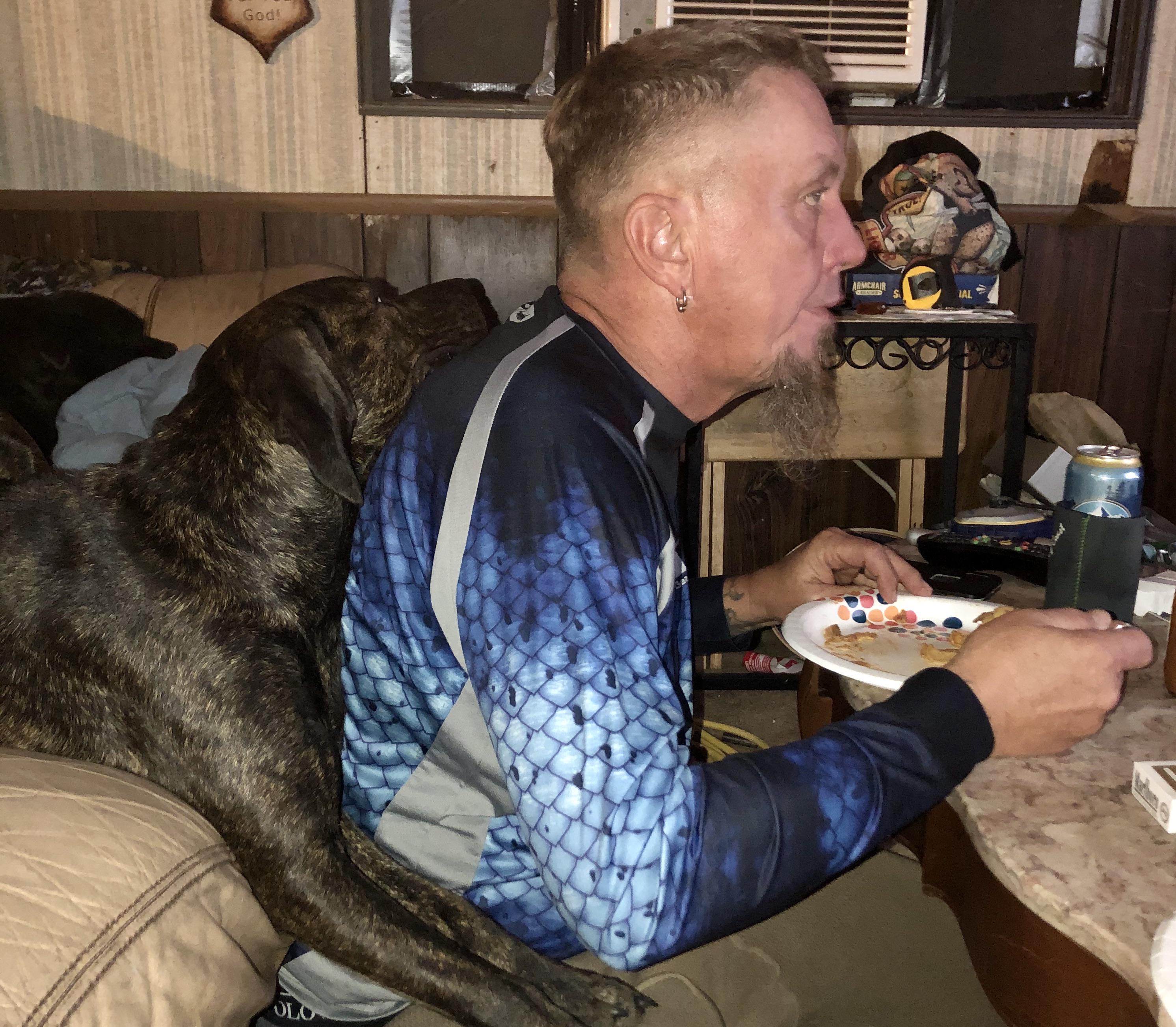 Every time he eats, Frankie dog a backpack. r