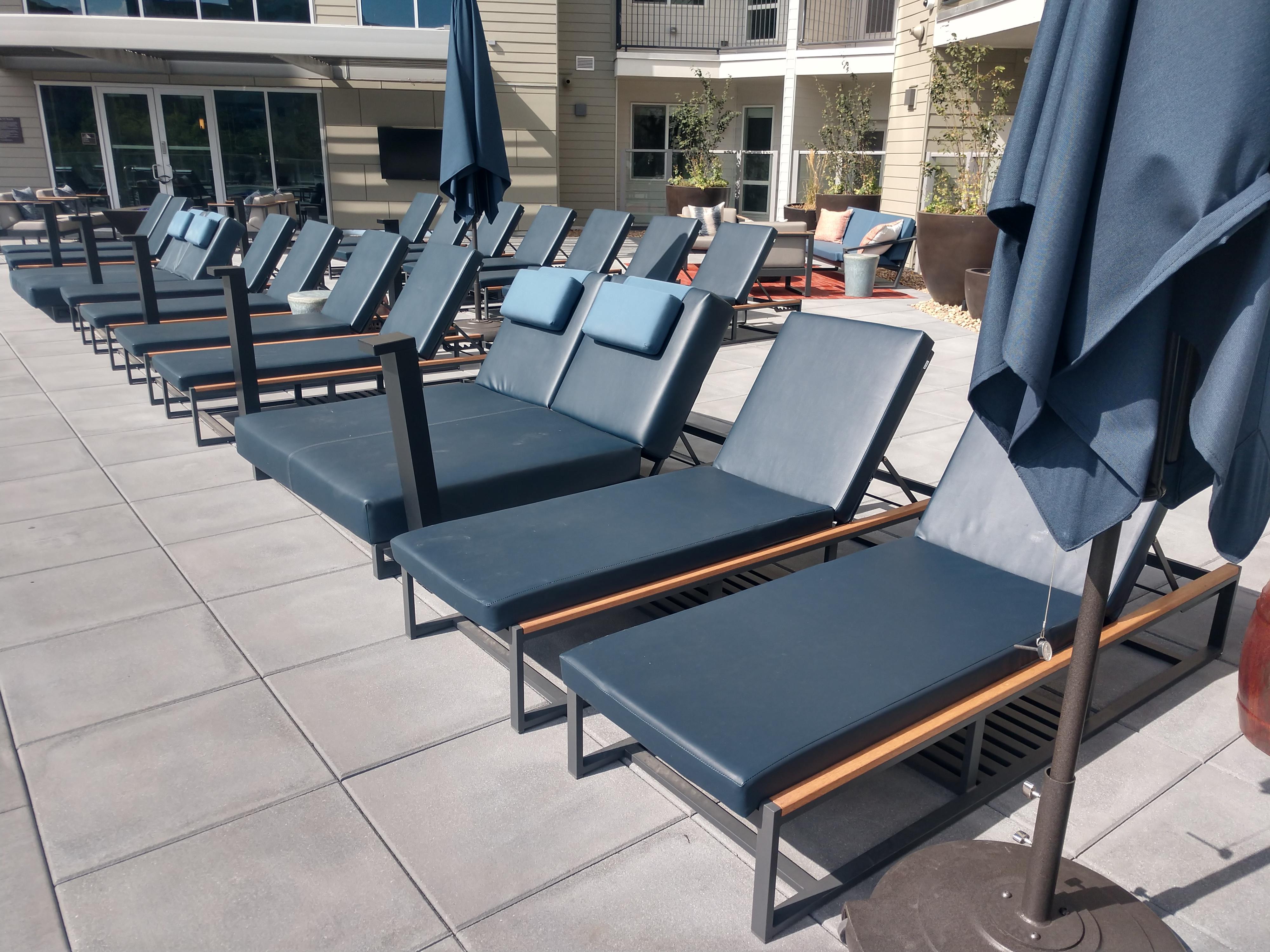 Dark navy, almost black vinyl pool chairs. Who thinks this is good idea