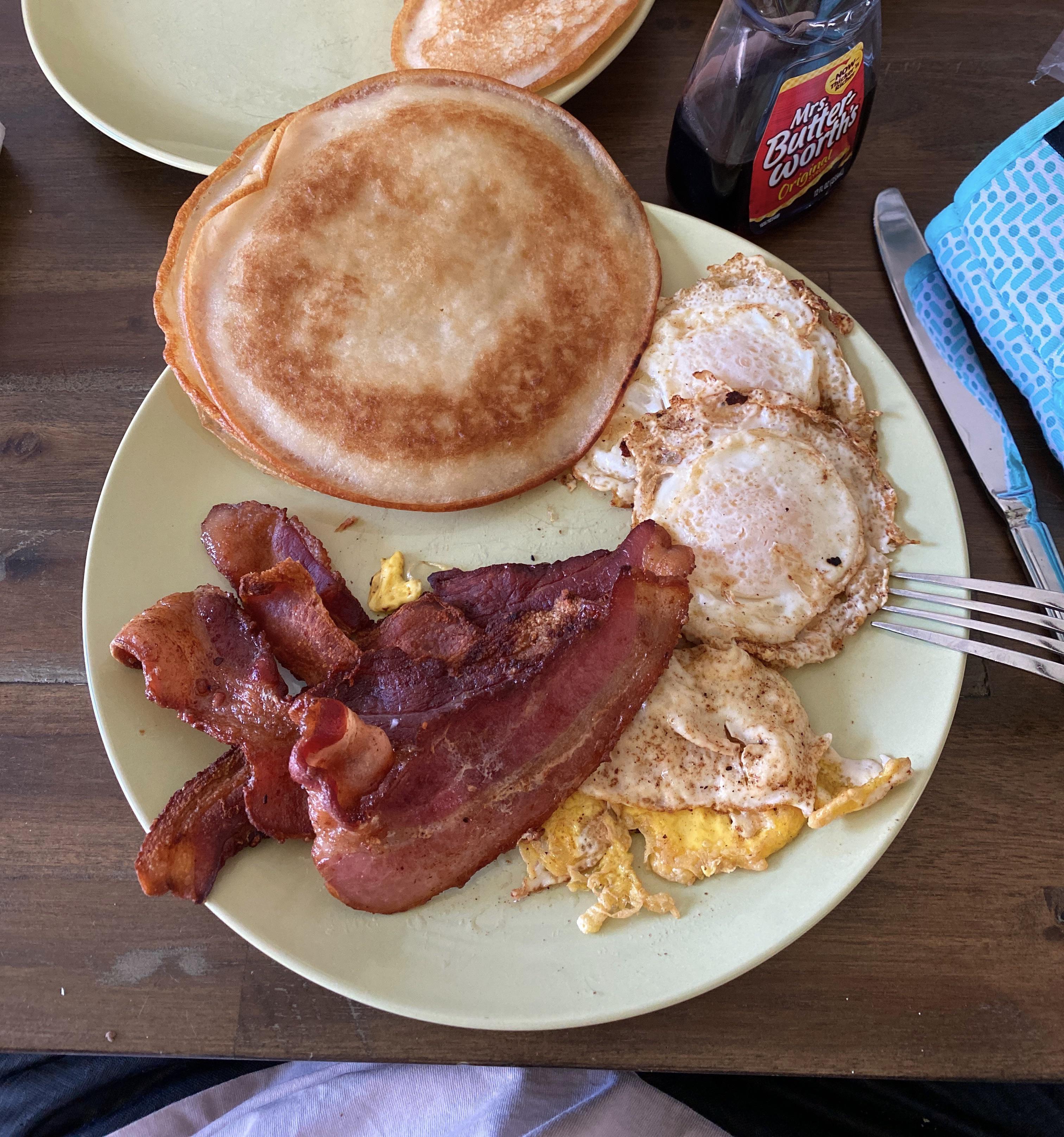 [Homemade] Crispy edge pancakes, bacon, and eggs over easy fried in