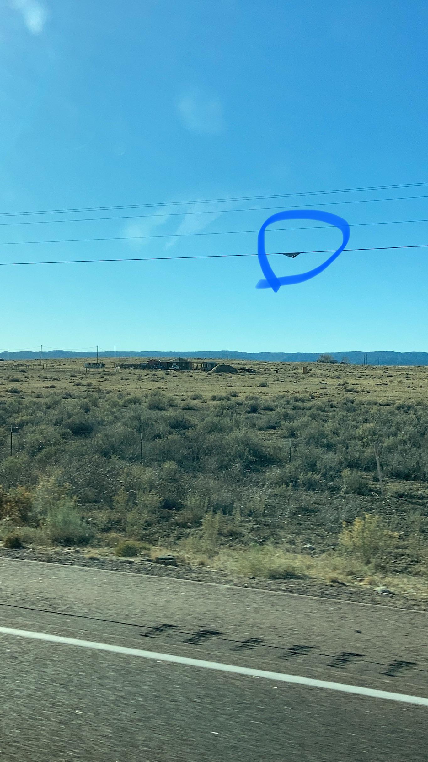 Metal triangles on power lines along 491 in rural NM whatisthisthing