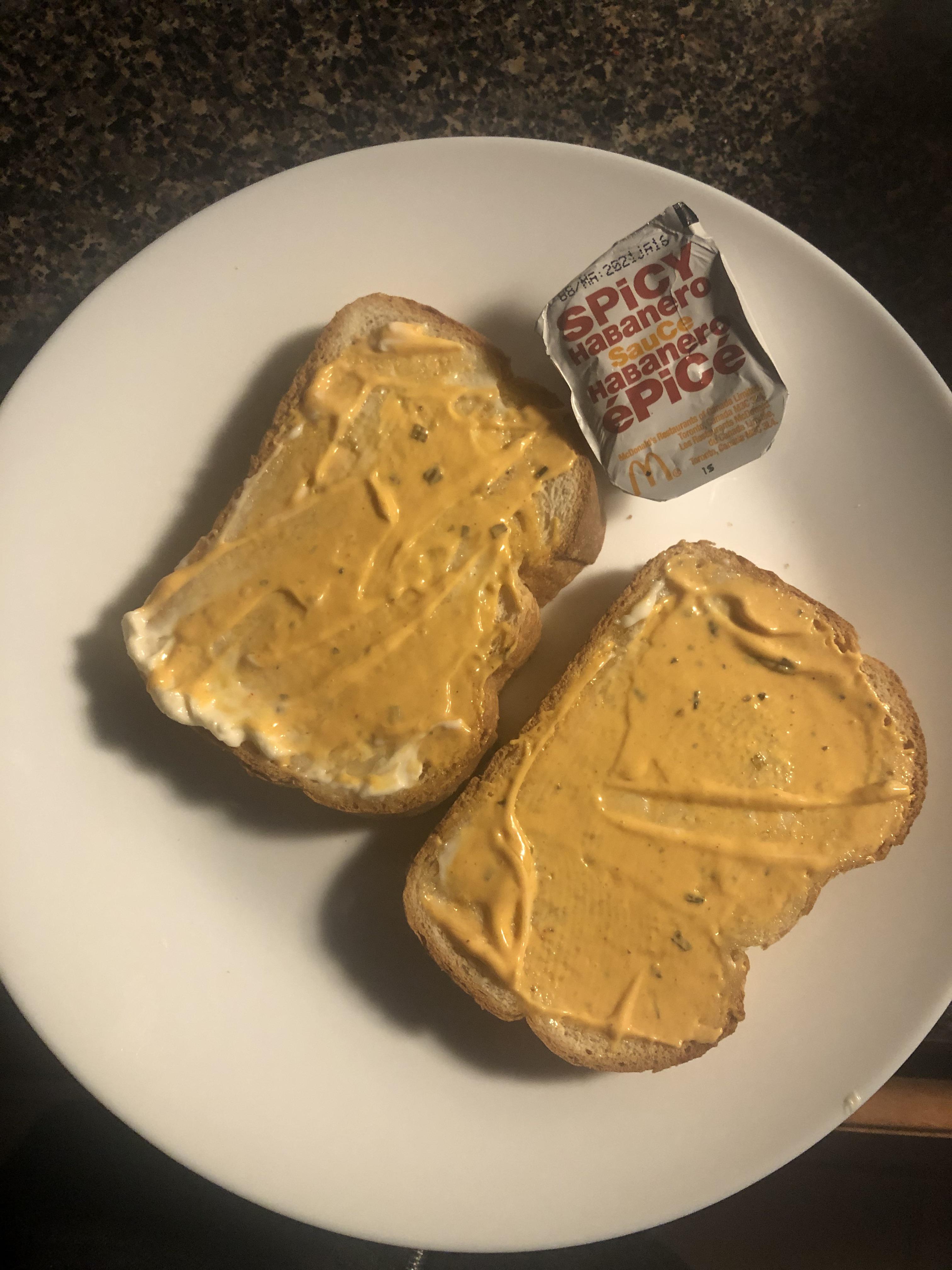 McDonald’s spicy habanero sauce on top of buttered white bread. r