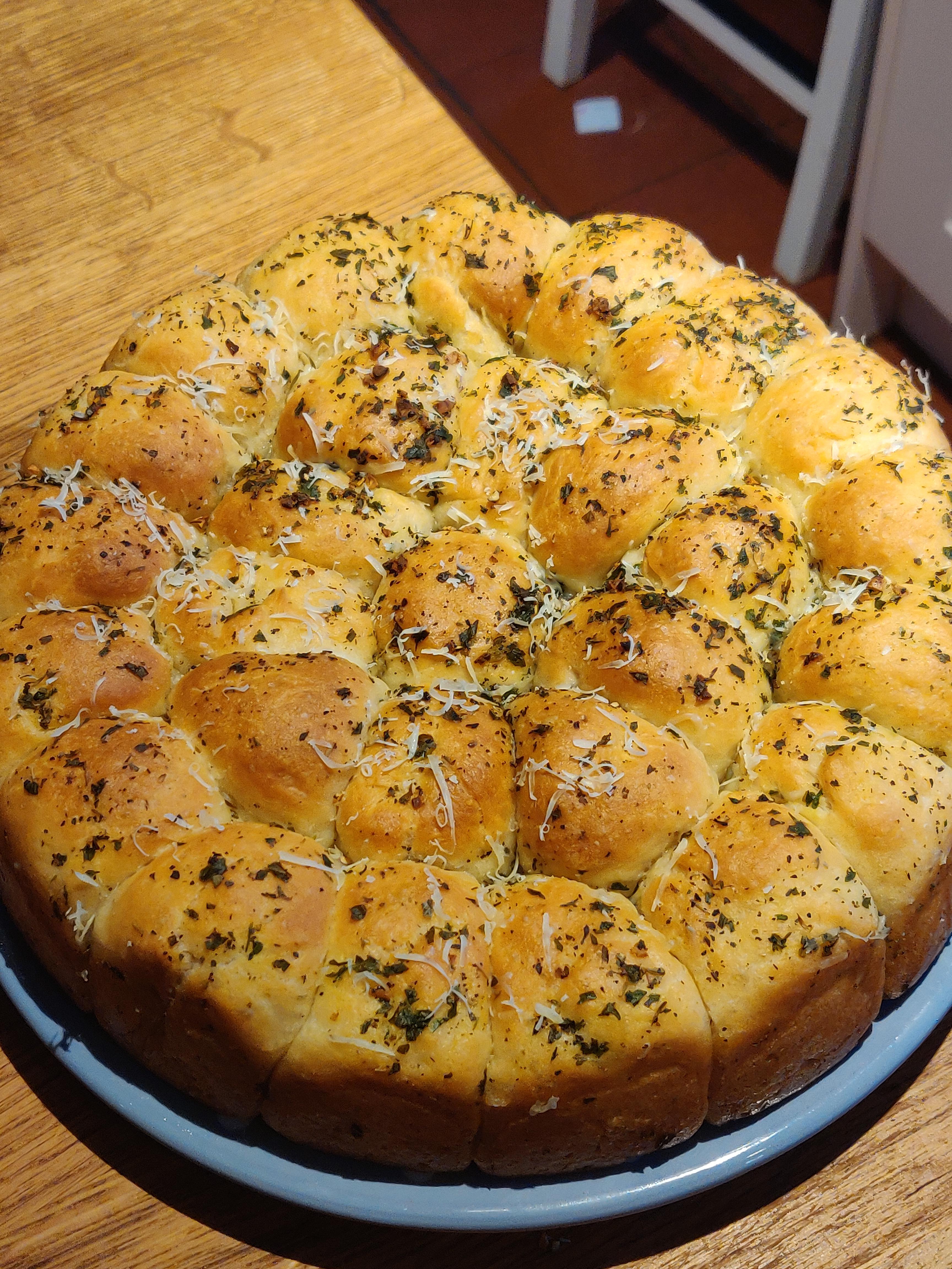 Pull apart bread topped with cheese, garlic, herbs and black pepper