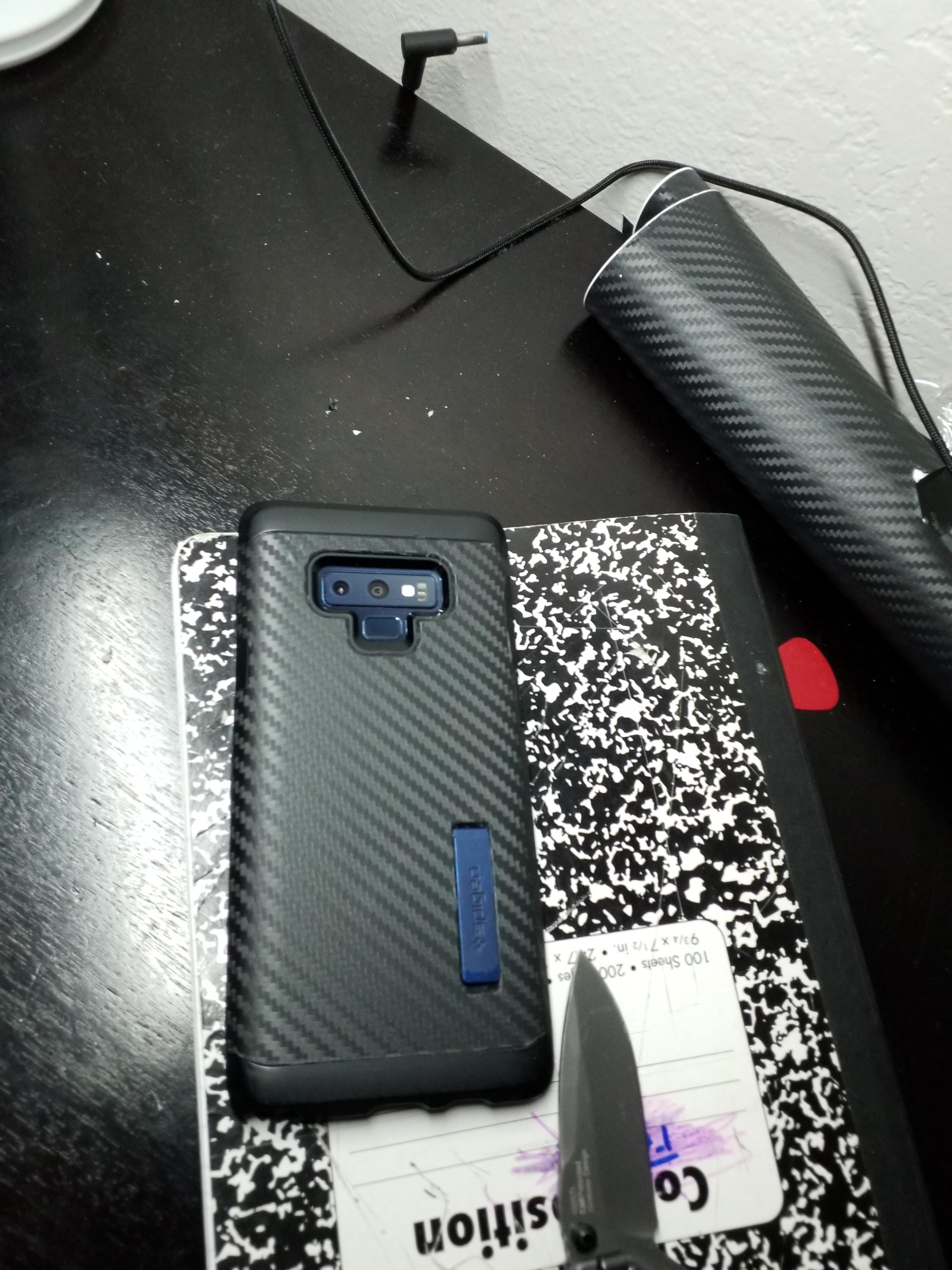 After not being able to find a carbon fiber case w/Kickstand that I