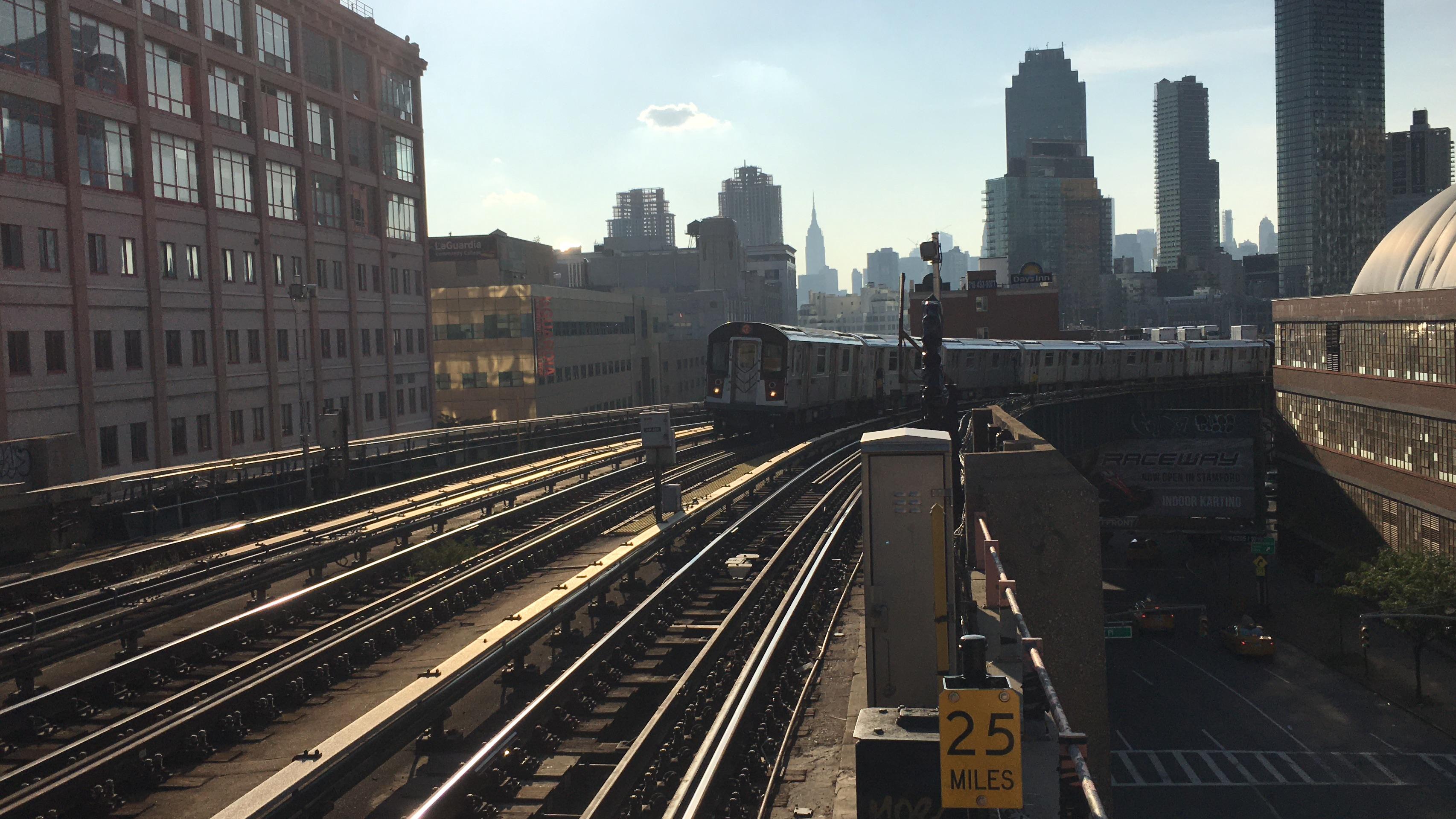 A 7 train rounding the curve into 33 StRawson St, August 2018. One of