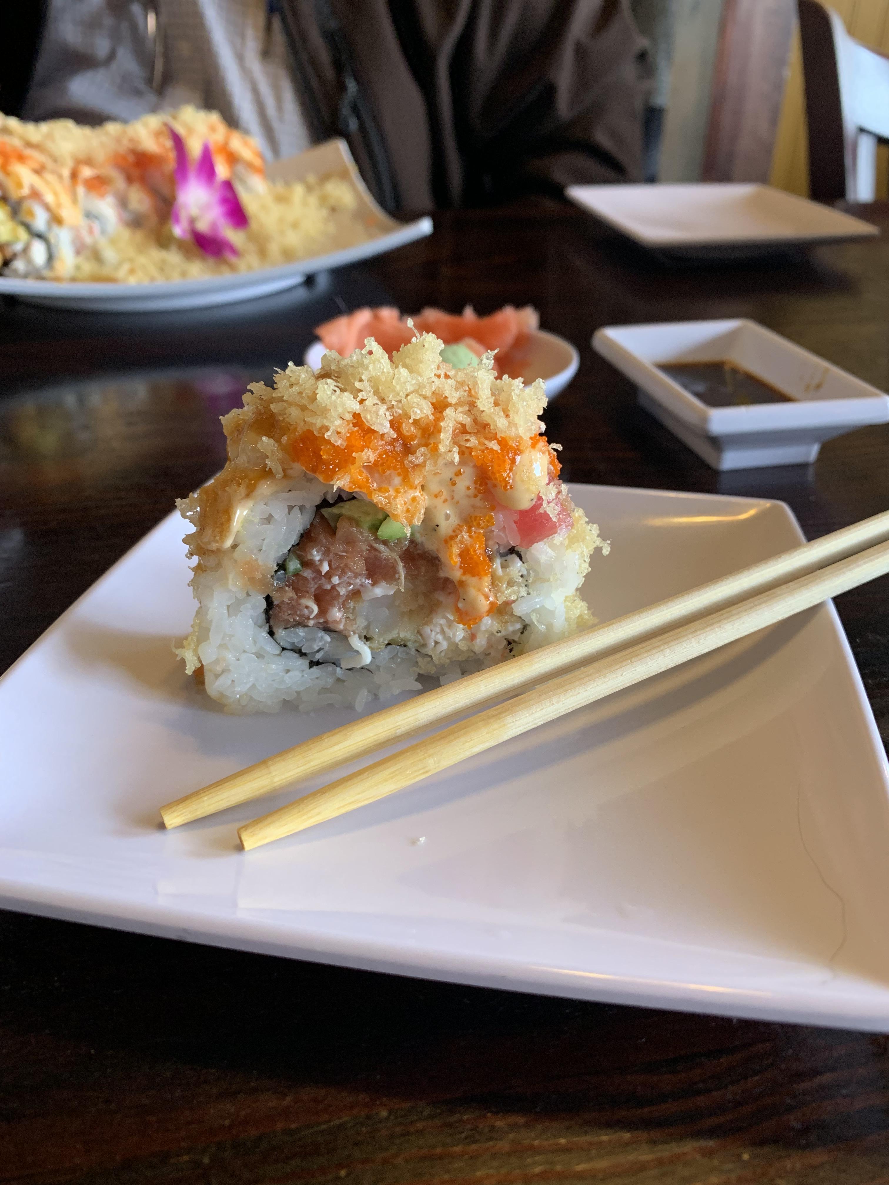 One piece of Gigantic Roll at UMI Sushi in Roseville. Chopsticks for