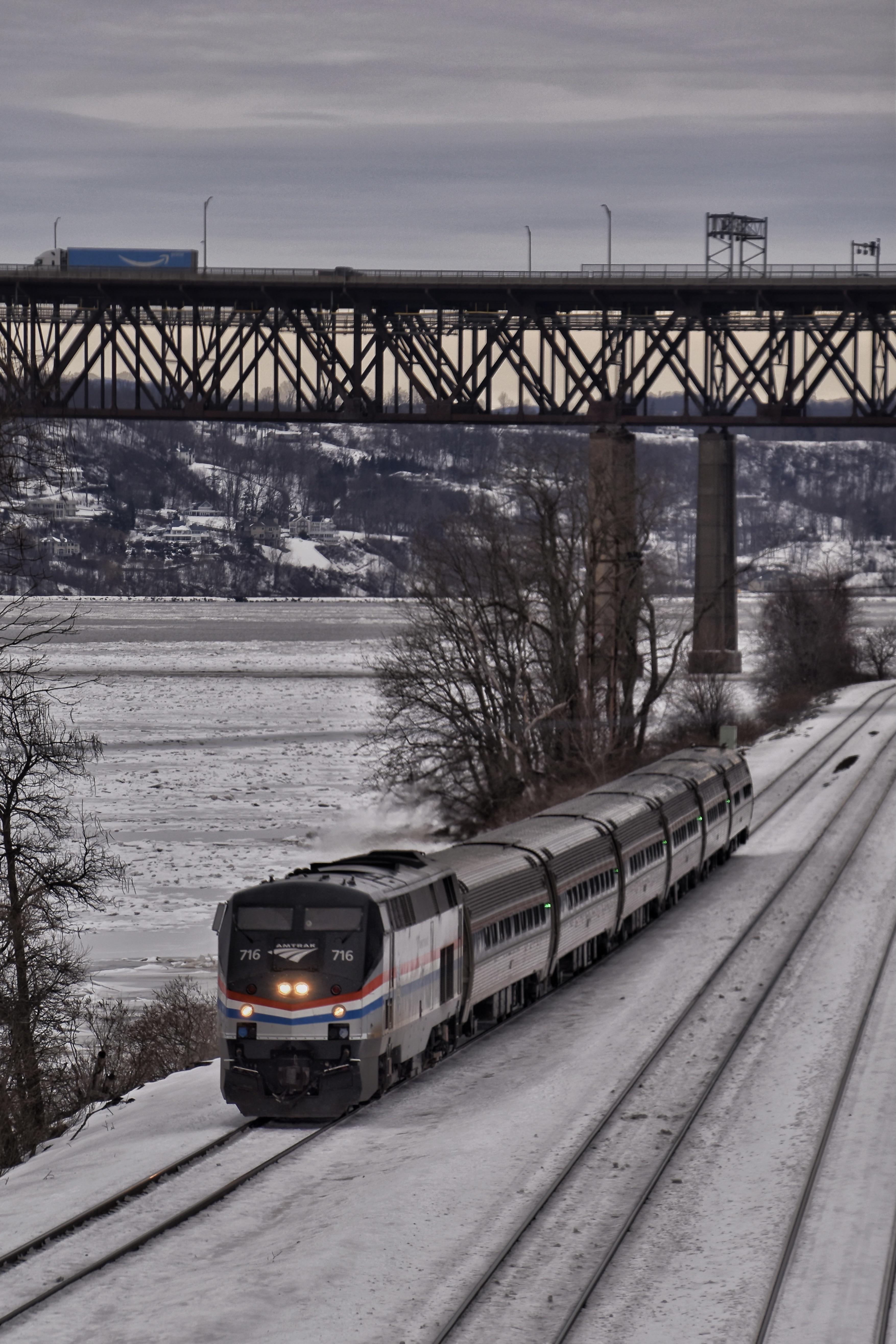Amtrak Empire Service train passing under the NewburghBeacon Bridge in