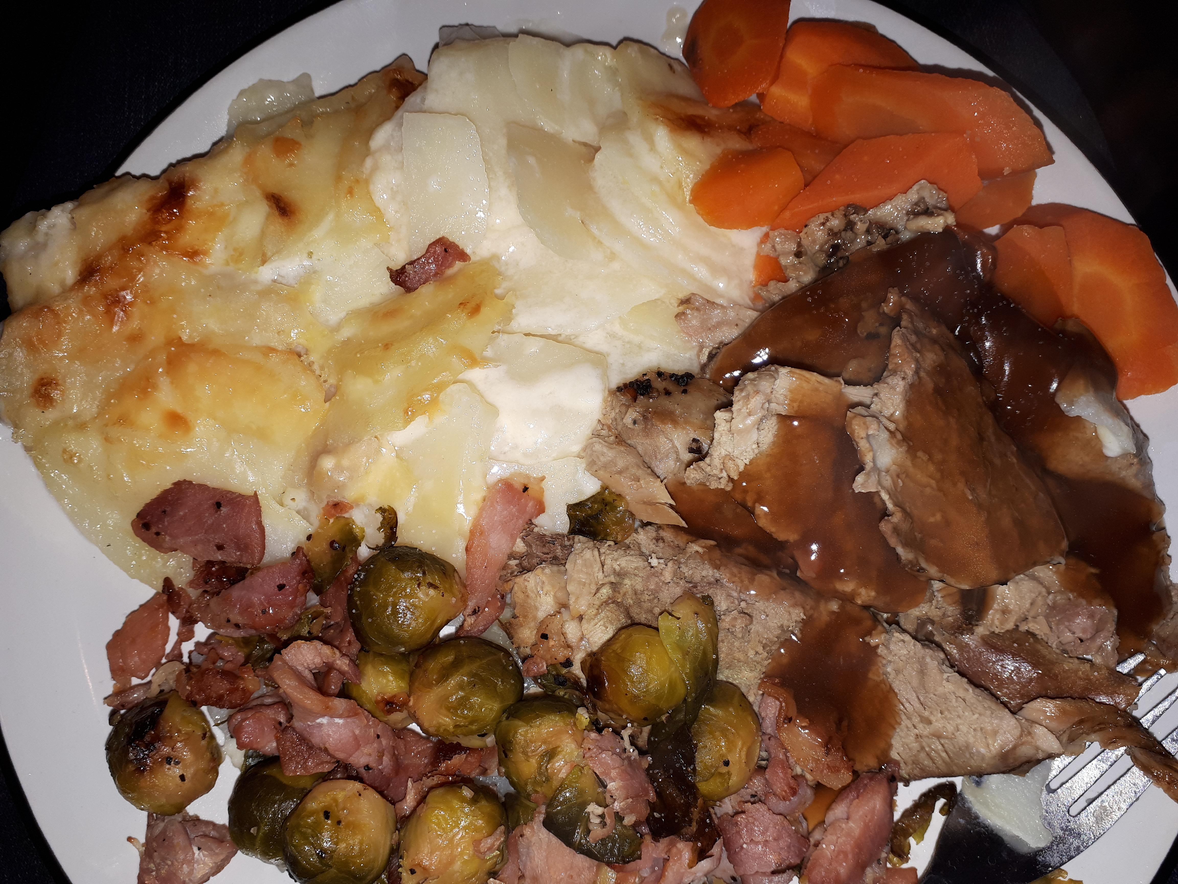 Slow cooked lamb, dauphinoise potatoes, sprouts with bacon and carrots