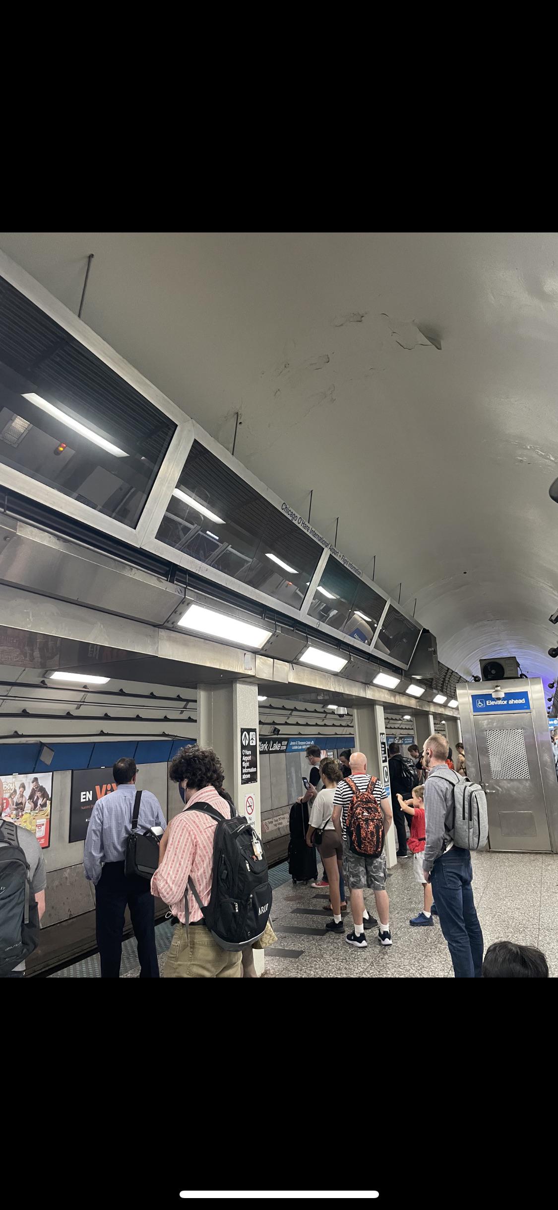 O’hare flight status screens seen at the Clark/Lake Blue Line station