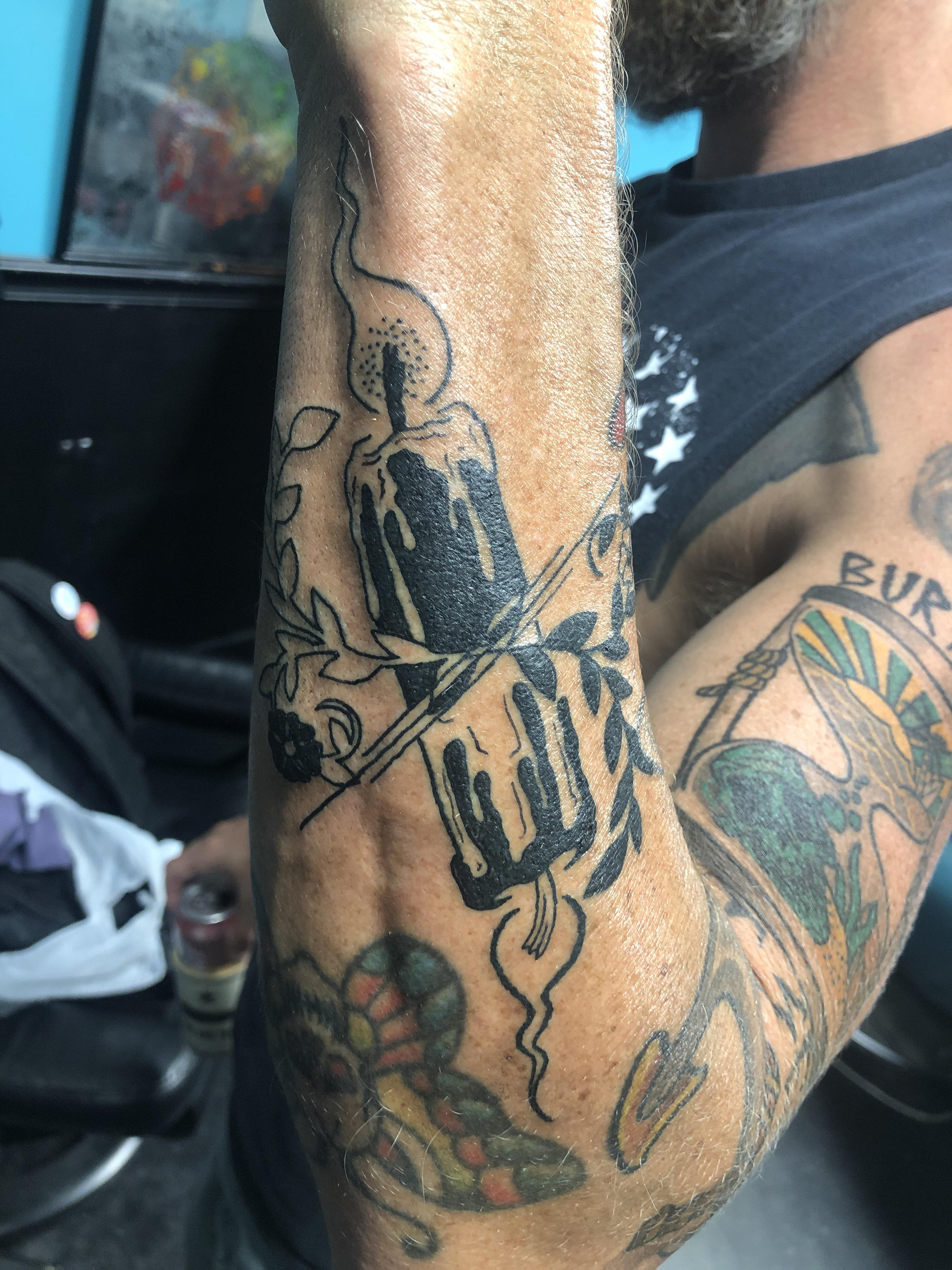 Burn it at a both ends . EW at Capital City Tattoos